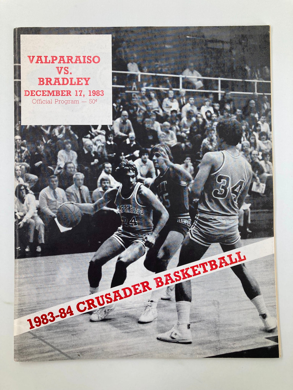 Cover of the December 17 1983 Valparaiso vs Bradley Crusader Basketball Program featuring action shot of players in a game setting.