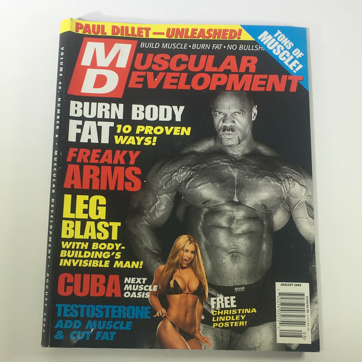 Cover of Muscular Development Magazine August 2003 featuring Ronnie Coleman and Christina Lyndley, highlighting bodybuilding news and fitness tips. The cover emphasizes weight loss techniques, arm workouts, and a special poster, making it a collectible issue for fitness enthusiasts.