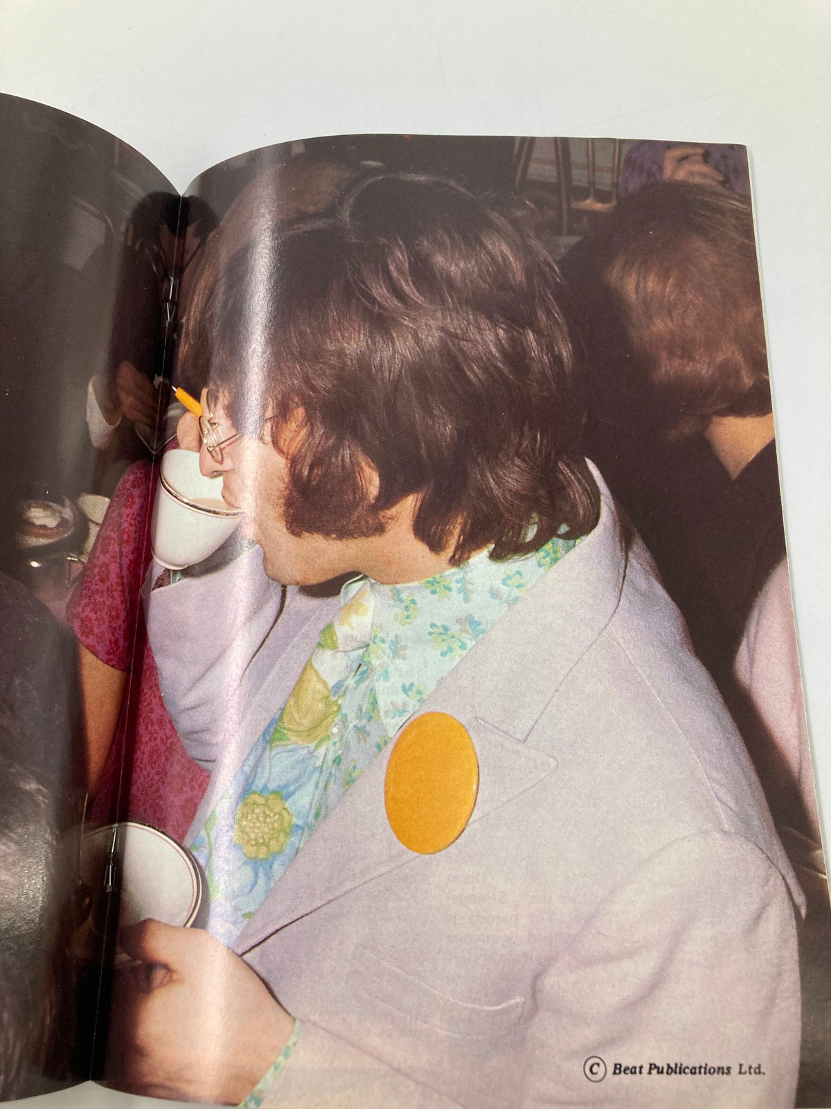 Close-up image of John Lennon during an event, featured in The Beatles Book Monthly Magazine May 1988 No. 145.