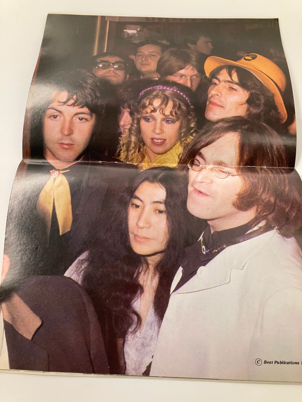 A group photo including Paul McCartney, Yoko Ono, and John Lennon from The Beatles Book Monthly Magazine August 1986 Issue #124, showcasing their camaraderie.