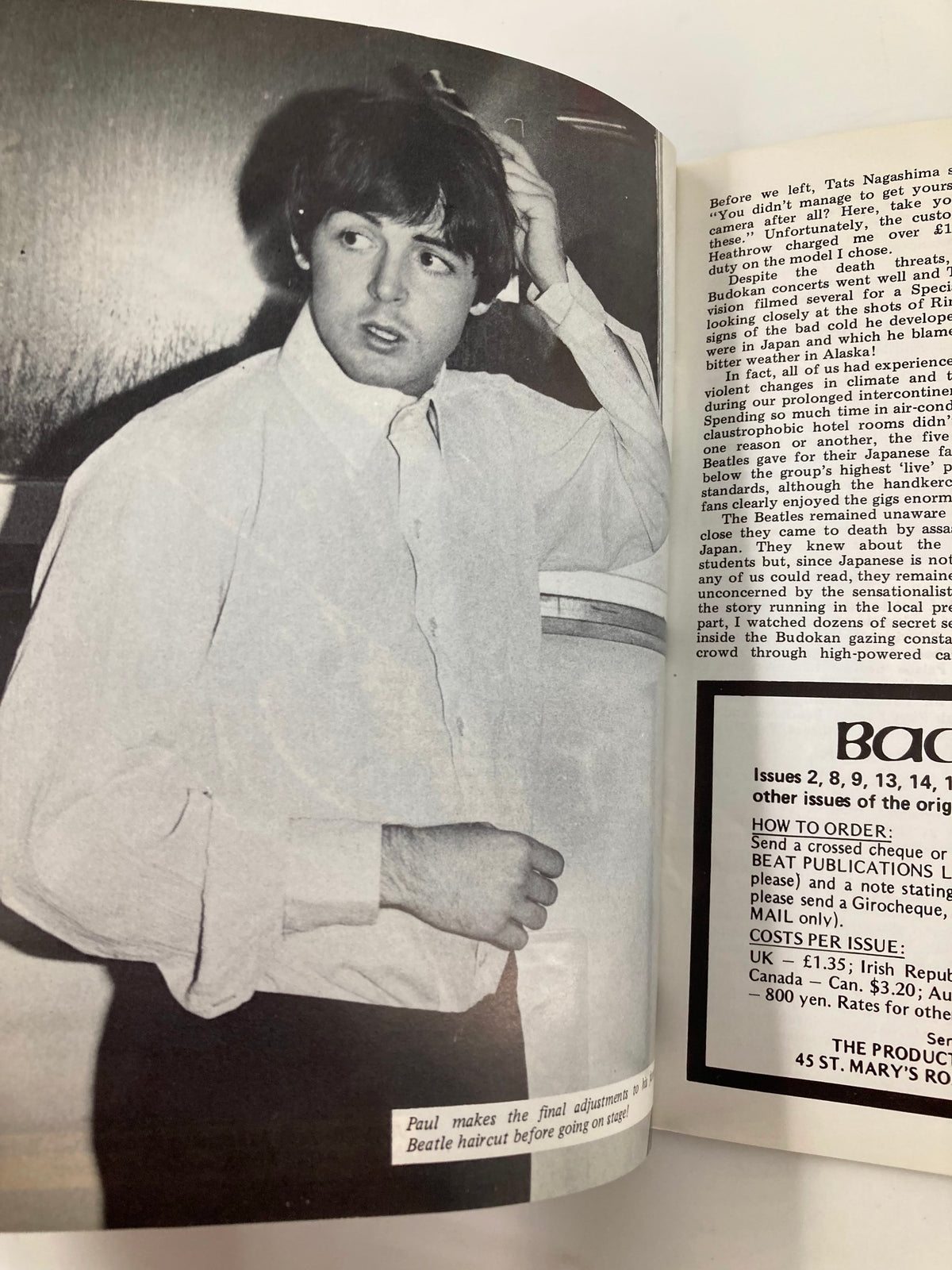 Black and white photo of Paul McCartney adjusting his hair before a performance, taken from The Beatles Book Monthly Magazine July 1986, Issue #123.