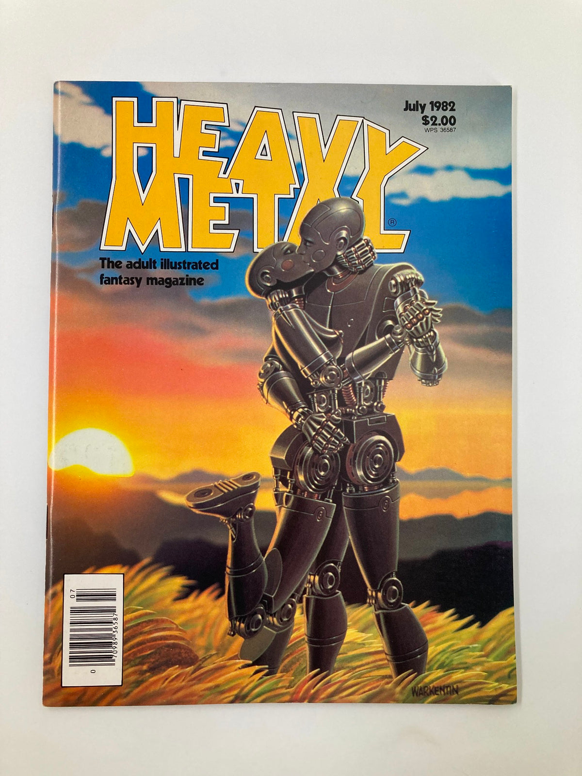 Cover of VTG Heavy Metal Magazine July 1982 featuring a robot couple against a sunset backdrop, celebrating its Cadmium Anniversary.