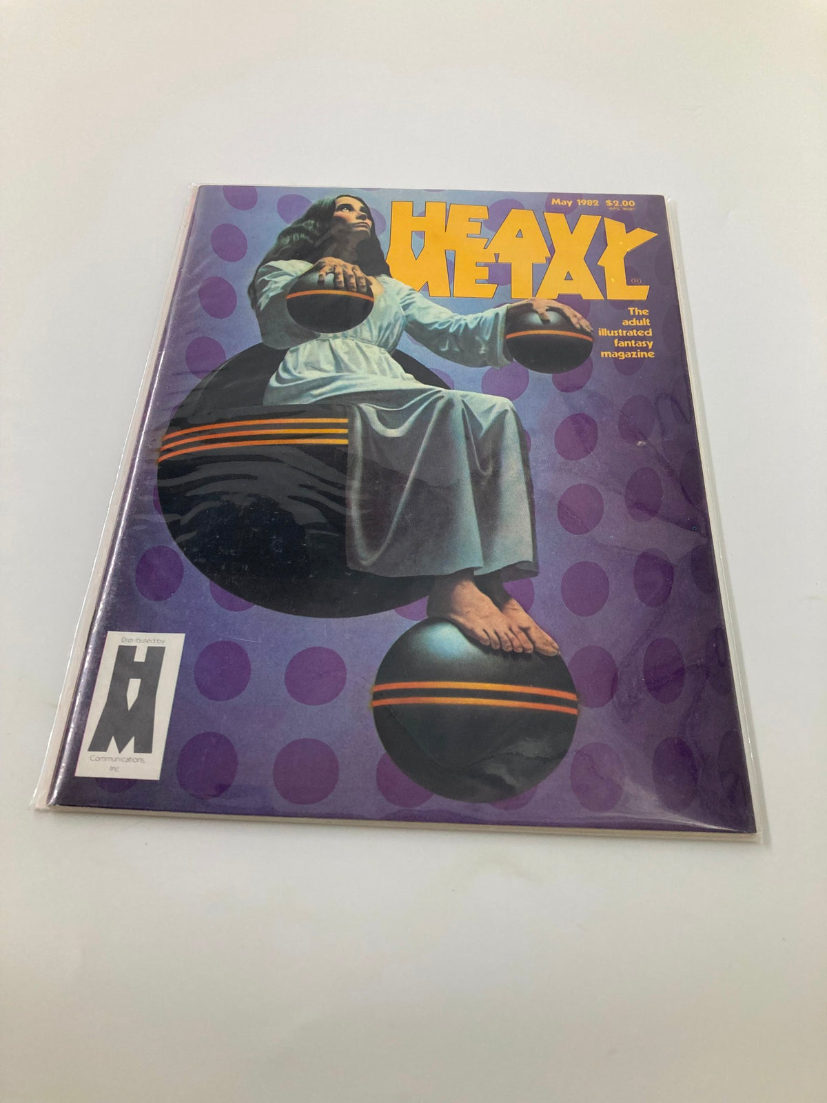 Protected VTG Heavy Metal Magazine May 1982 with cover illustration by Richard Cohen in a plastic sleeve, showcasing its collectible condition.