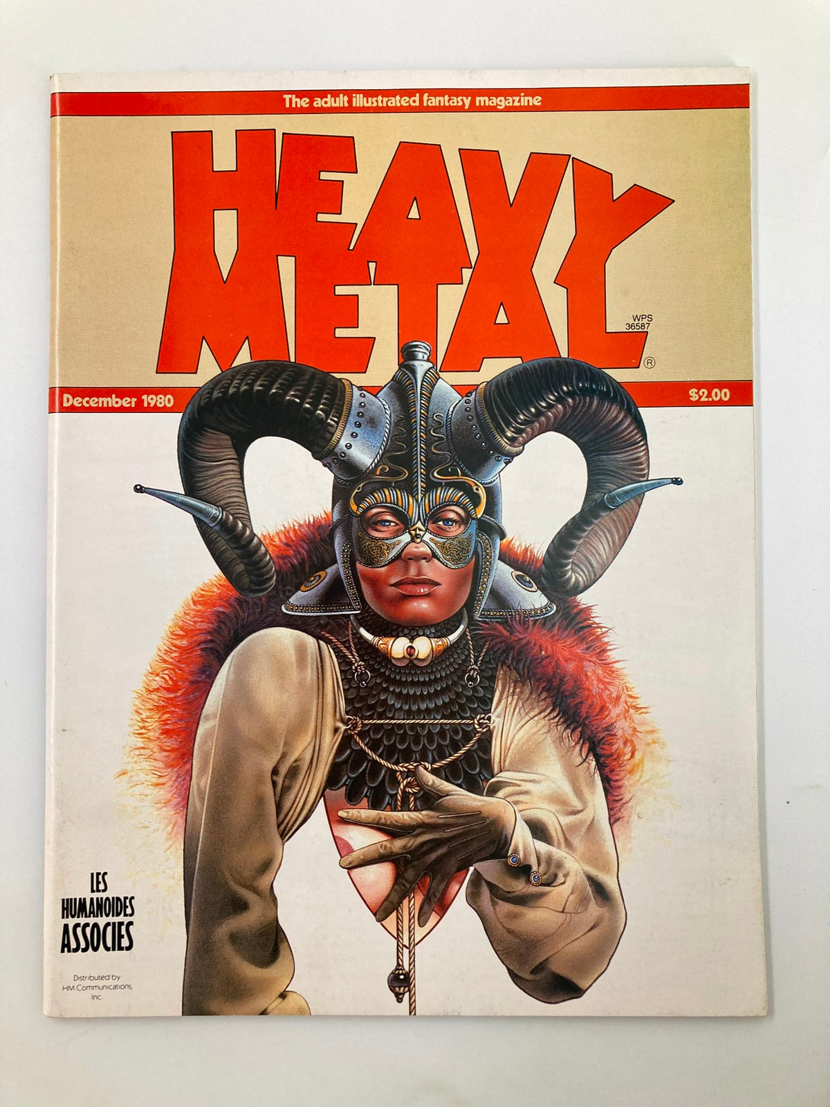 VTG Heavy Metal Magazine December 1980 featuring an extraordinary cover illustration by Christos Achilleos. The cover showcases a bold fantasy character adorned with ram horns and intricate details.
