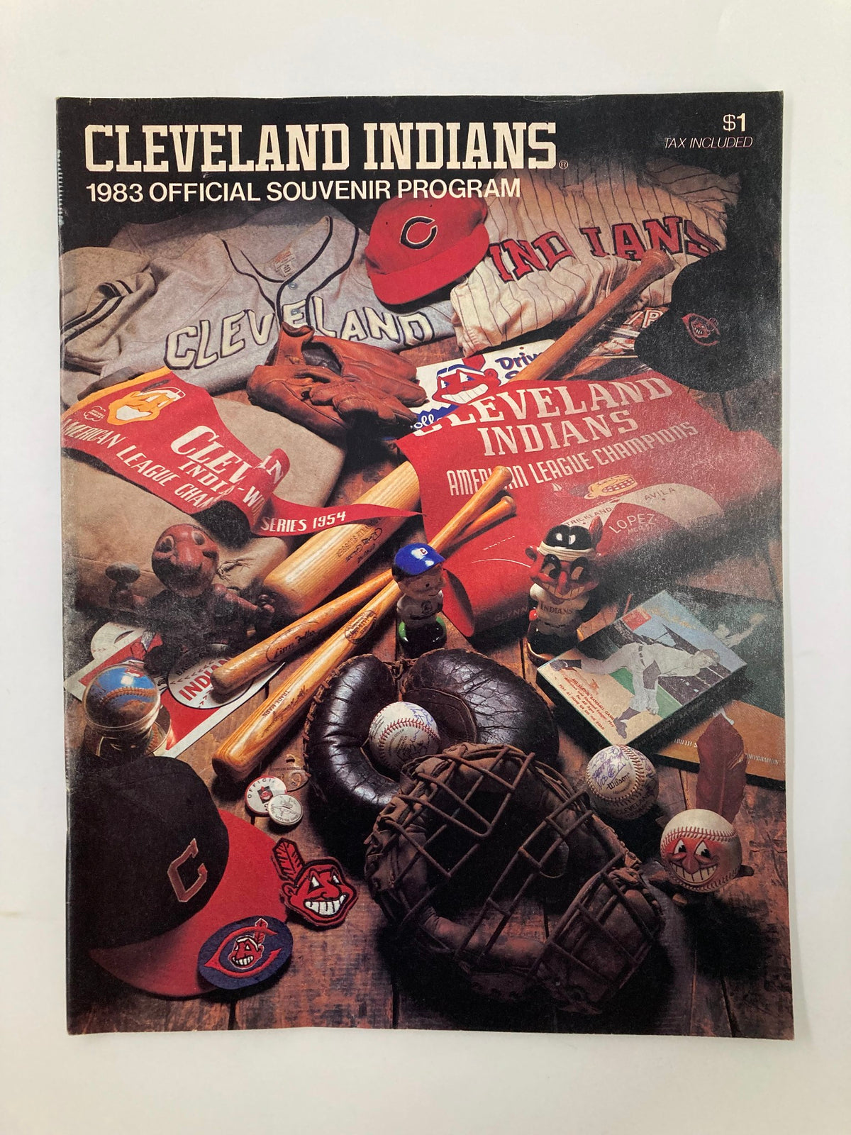 1983 MLB Cleveland Indians Official Souvenir Program featuring the program cover with baseball memorabilia, including bats and balls, and team logos.