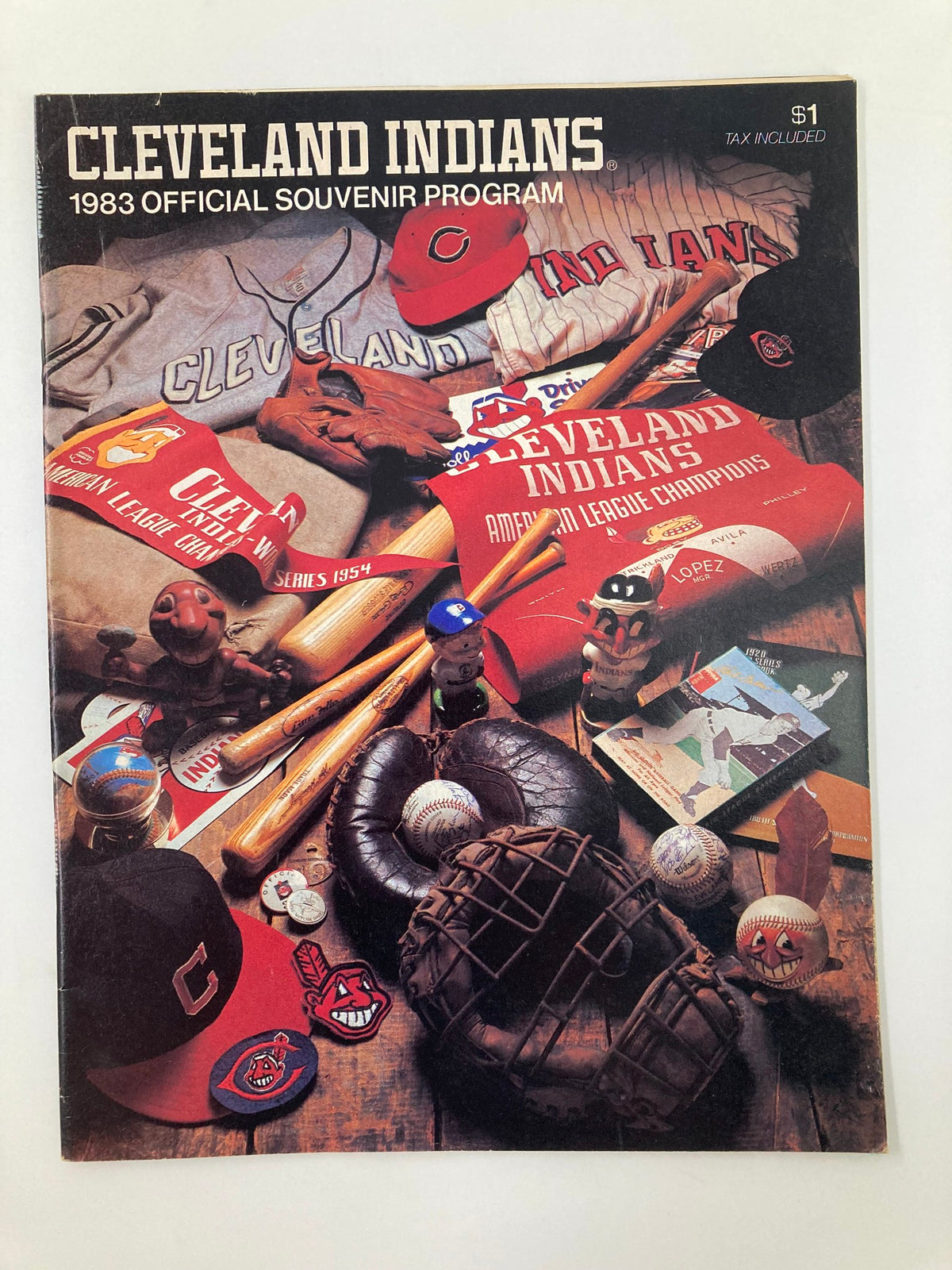 1983 MLB Cleveland Indians vs Kansas City Royals Official Souvenir Program featuring baseball memorabilia, including team hats, bats, and gloves, in good condition with minor wear.