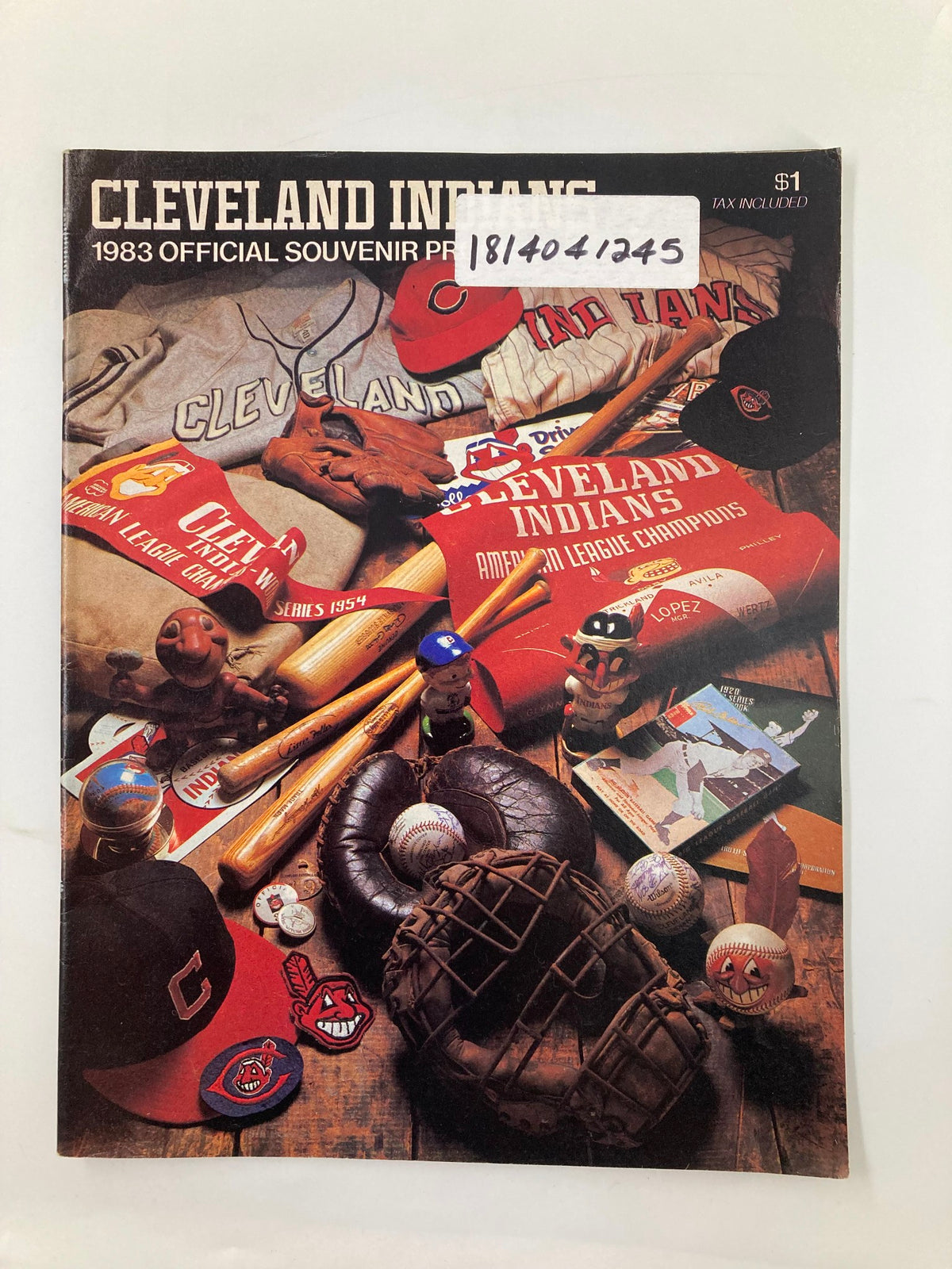 1983 MLB Cleveland Indians vs Baltimore Orioles Official Souvenir Program cover featuring baseball memorabilia, including hats and baseballs, with the price tag and signature displayed.