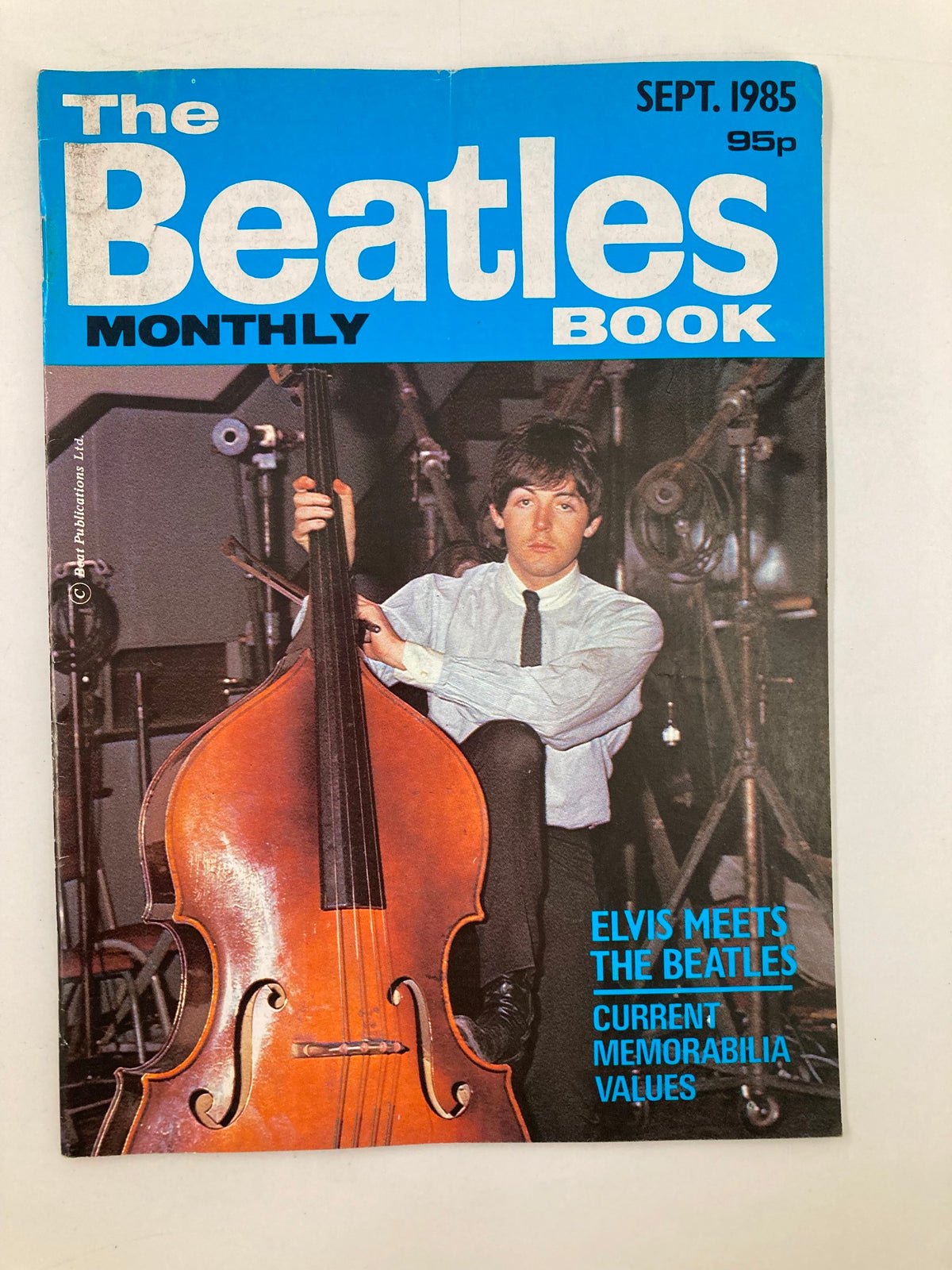 Cover of The Beatles Book Monthly Magazine September 1985 Issue #113 featuring Paul McCartney with a double bass, showcasing the iconic magazine's retro design.