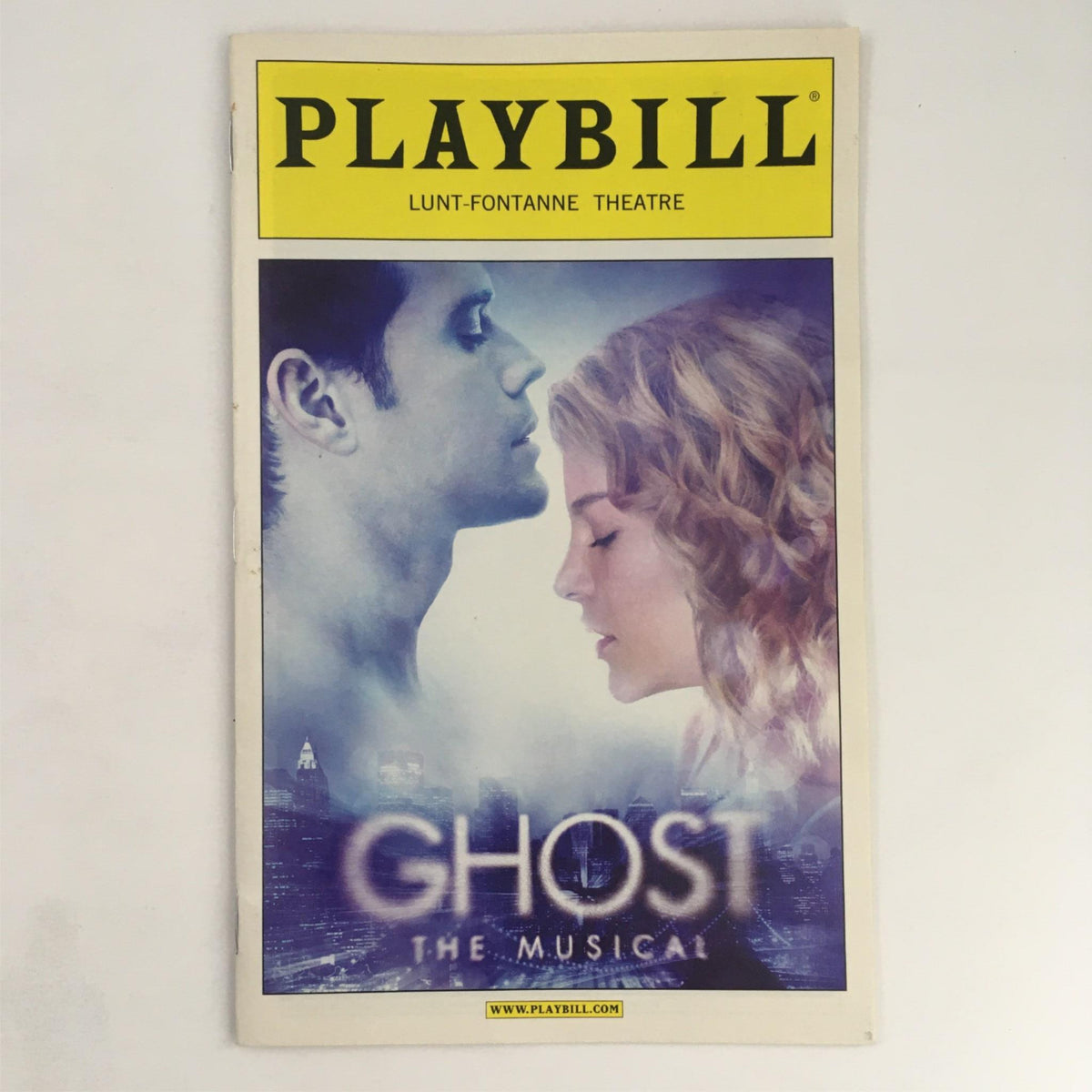 2012 Playbill for Ghost The Musical at Lunt-Fontanne Theatre featuring romantic artwork of lead characters.