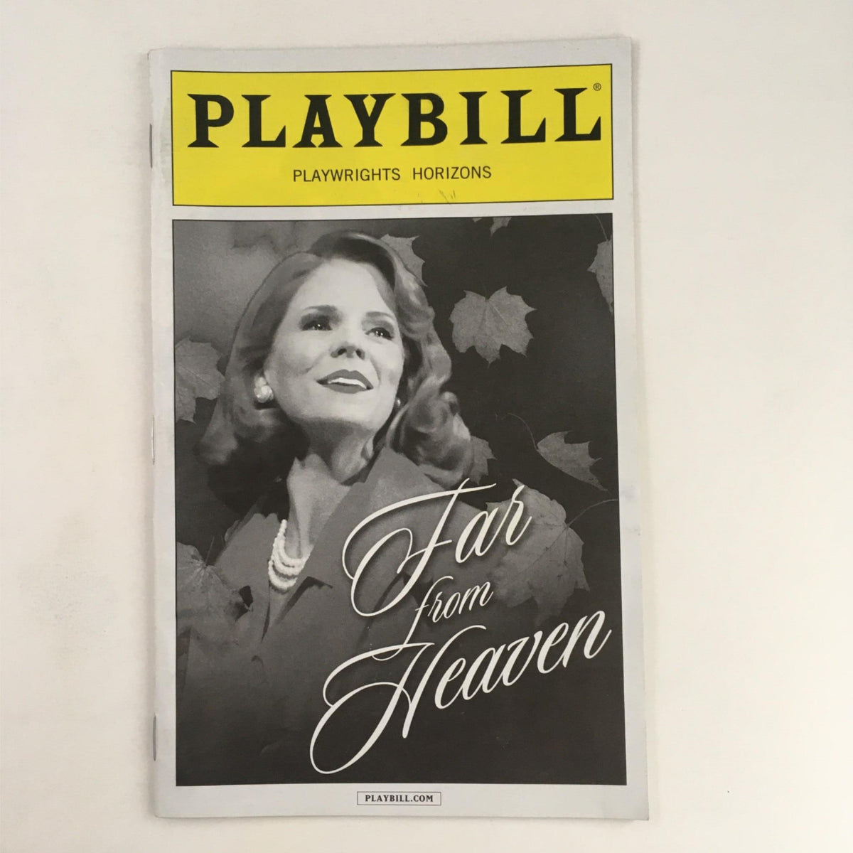 2013 Playbill for 'Far From Heaven' directed by Michael Greif at Playwrights Horizons, featuring a black and white image of a female lead with the title elegantly displayed.