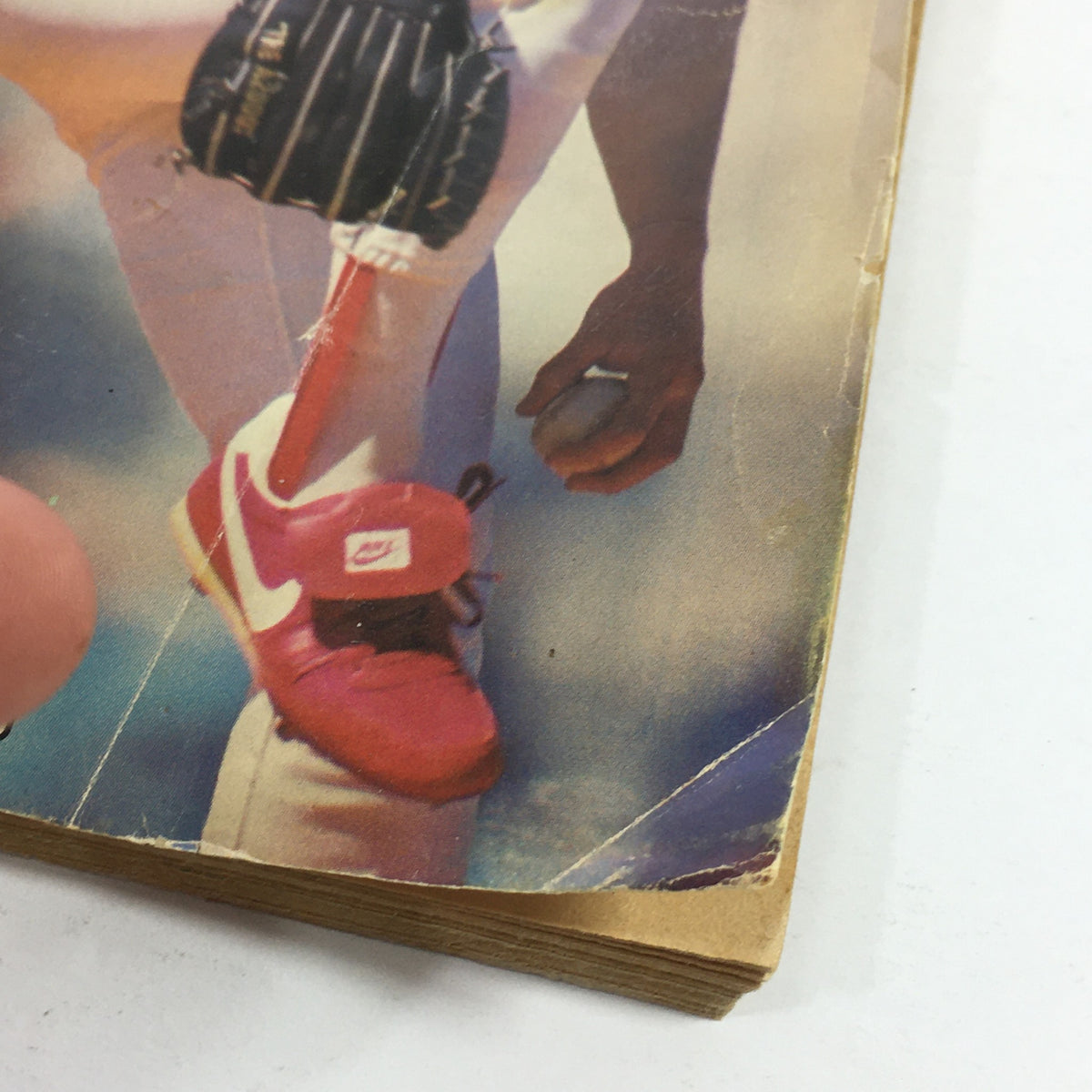 Close-up view of a vintage Baseball Digest magazine from December 1988 featuring a player in Nike shoes, representing the comeback story of Danny Jackson.