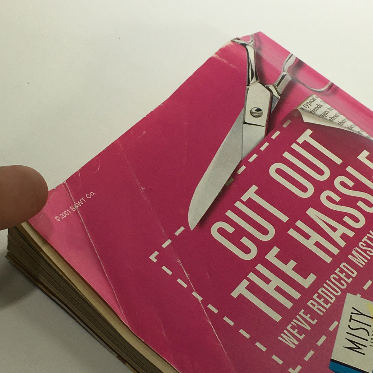 Close-up view of the back cover of VTG TV Guide Magazine November 3-9, 2001, showing 'Cut Out the Hassle' promotional text and signs of wear, illustrating its vintage nature.