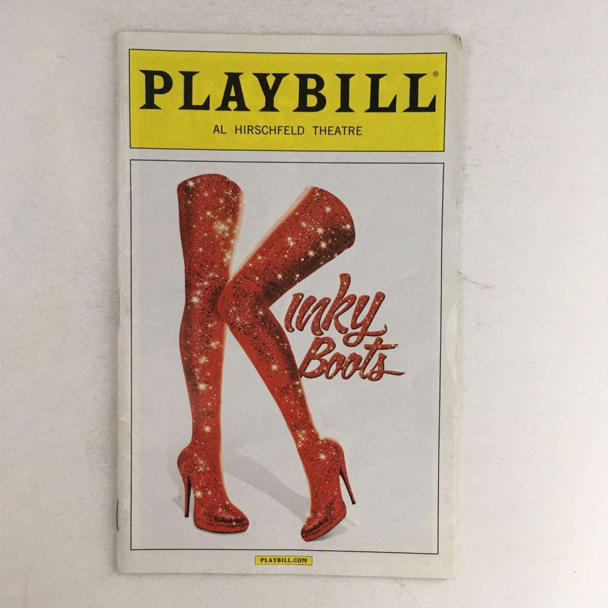 2015 Playbill for Kinky Boots featuring iconic red glittering boots at Al Hirschfeld Theatre, showcasing Broadway memorabilia.