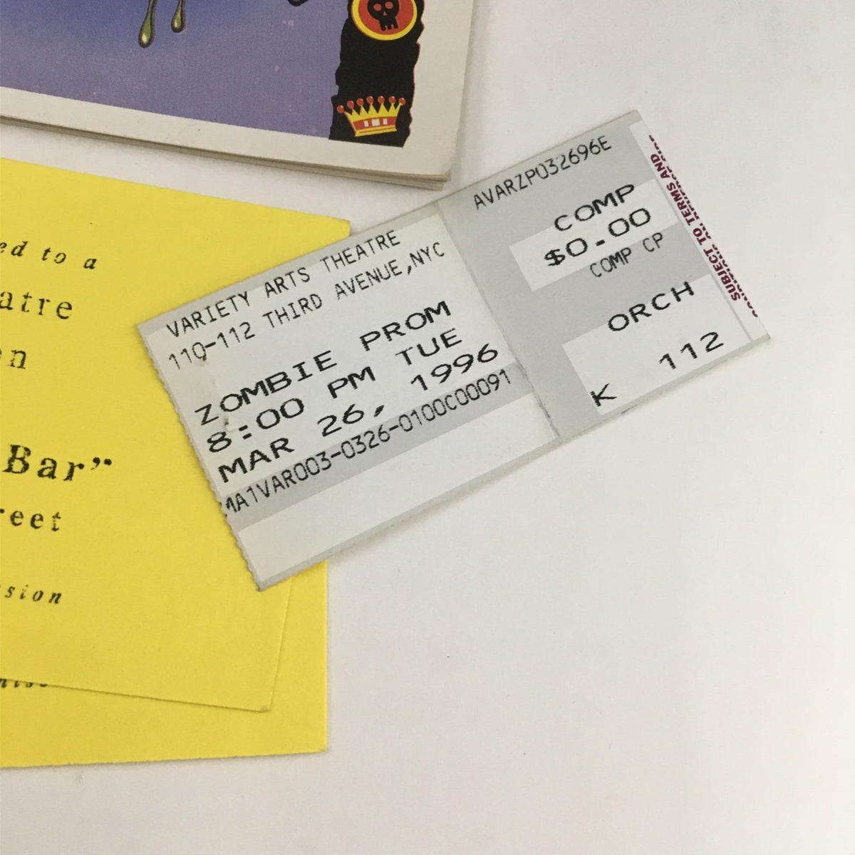 Close-up of the ticket stubs for the 1996 Zombie Prom at Variety Arts Theatre, showcasing the date and details of the performance, along with a post-theatre reception invitation.