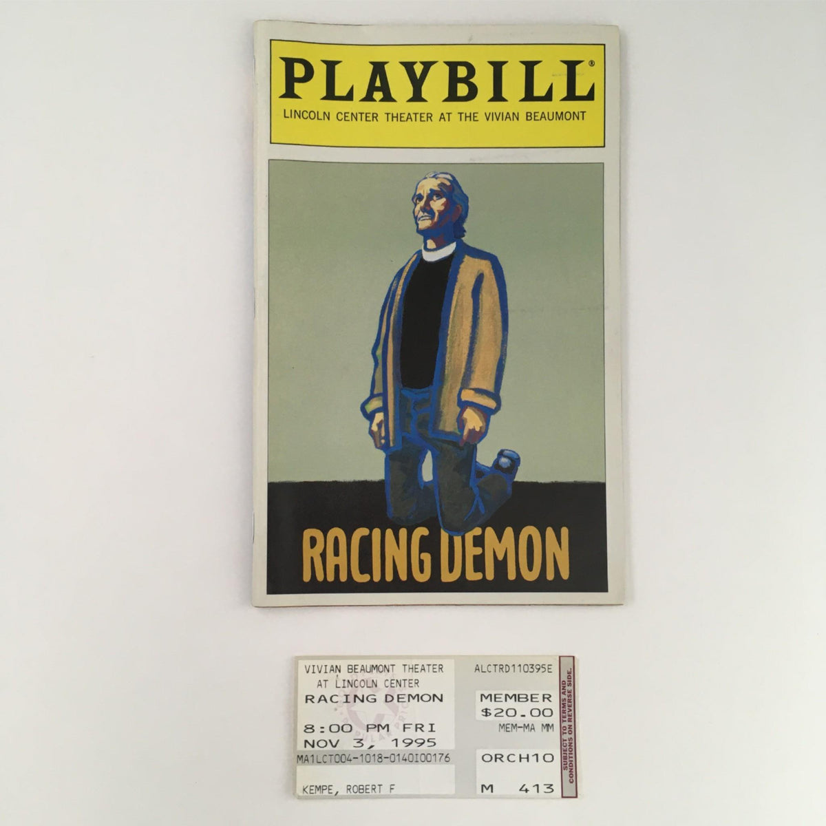 1995 Playbill for Racing Demon featuring vibrant cover art, original ticket stub, and details from Lincoln Center Theatre production.