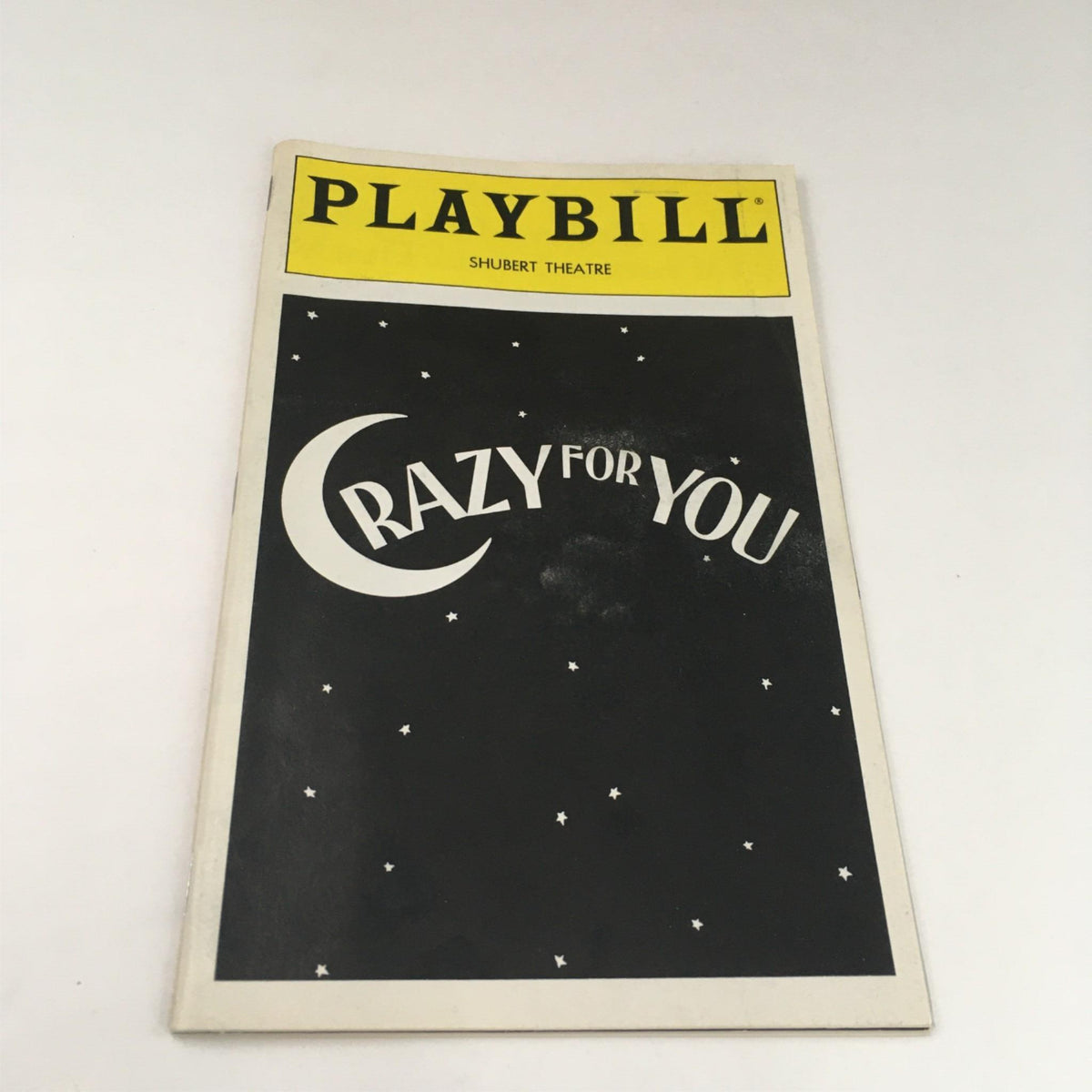 1995 Playbill Crazy For You showcasing the front cover design with distinctive black and yellow color scheme.