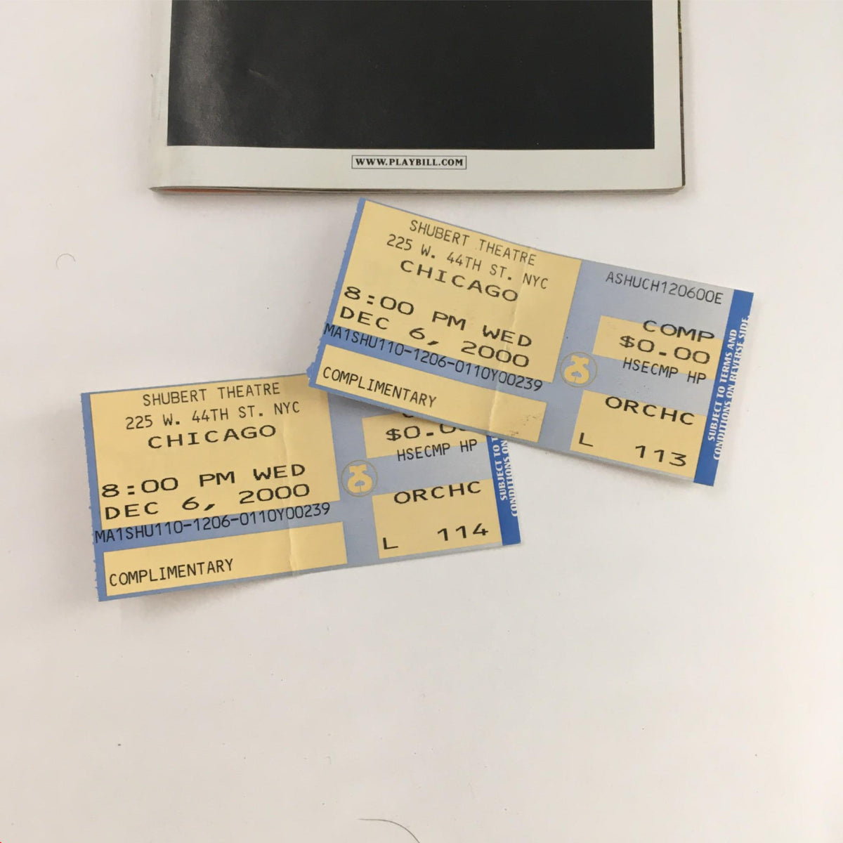 Close-up of the original tickets for the 2000 Chicago show at Sam S. Shubert Theatre, featuring blue and yellow color scheme.