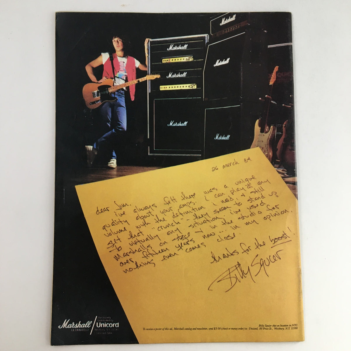 The American Band Magazine November 1984 featuring Eddie Van Halen on the cover, showcasing rock history. The image captures a handwritten note in front of Marshall amplifiers, enhancing the vintage music memorabilia aspect.