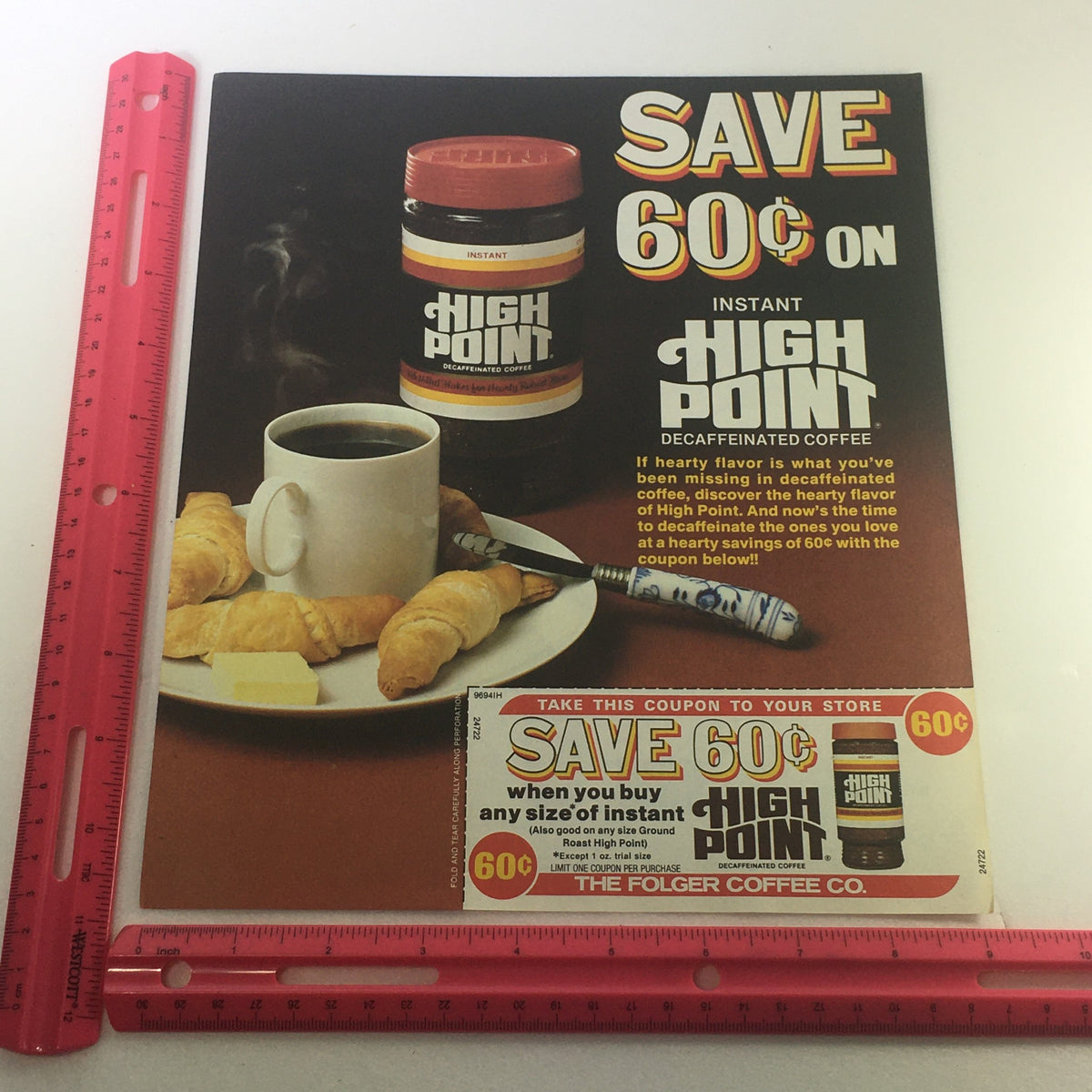 VTG 1989 The Folger Coffee Co.'s Instant High Point Decaffeinated Coffee Coupon featuring a vibrant advertisement with a jar of High Point coffee, a steaming cup of coffee, and a visible ruler for size reference.