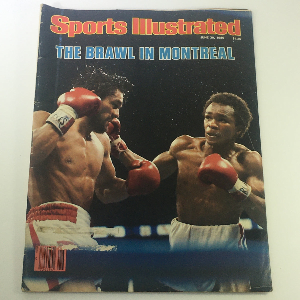 Sports Illustrated Magazine cover from June 30, 1980, featuring a dramatic boxing match between Roberto Duran and Sugar Ray Leonard, titled 'The Brawl in Montreal'. This vintage magazine is a significant collectible for boxing enthusiasts.
