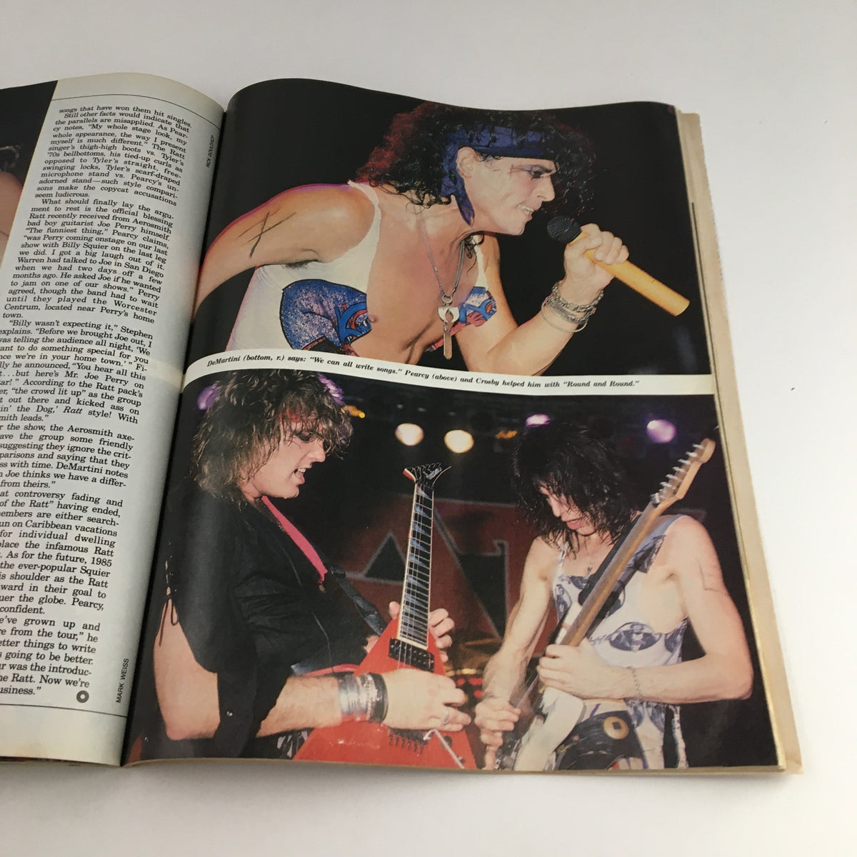 Circus Magazine January 31 1985 photo capturing a dynamic performance by rock musicians, highlighting an energetic singer and guitarist in action.