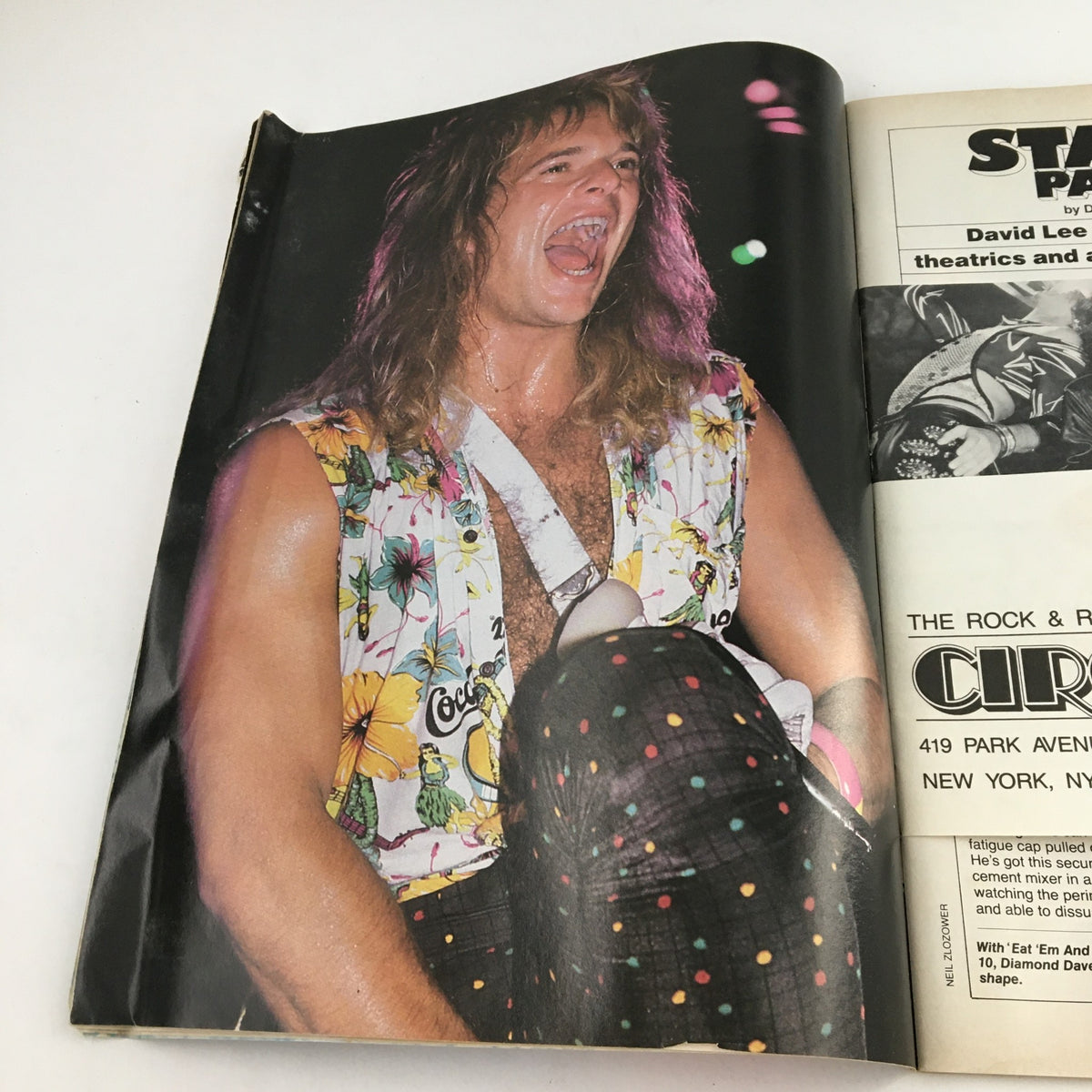 Full-page image from Circus Magazine November 30 1986 showcasing a lively performance by a rock artist sporting vibrant attire.