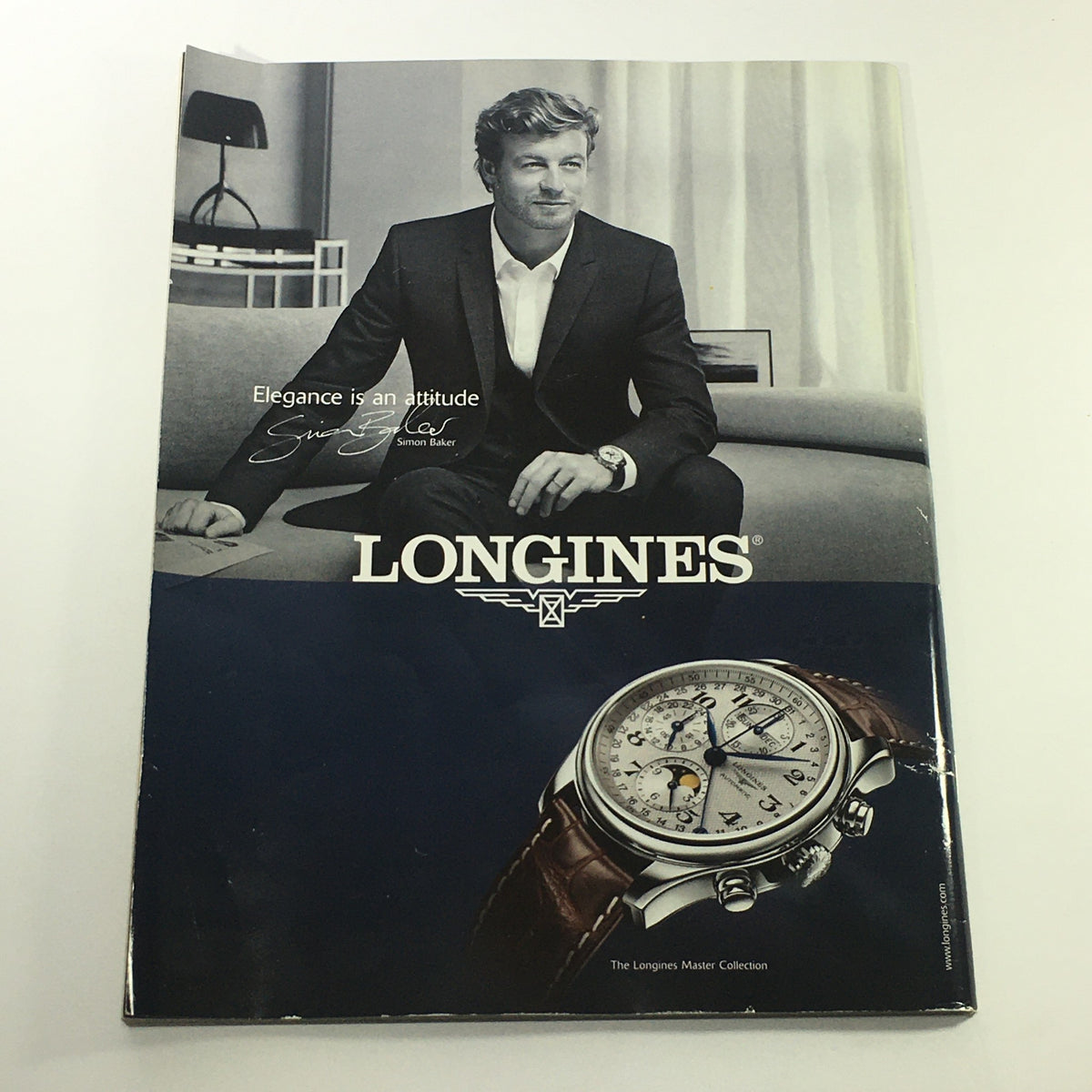 Longines advertisement showcasing elegance with a stylish male model and a luxury watch, illustrating sophistication and timeless design.
