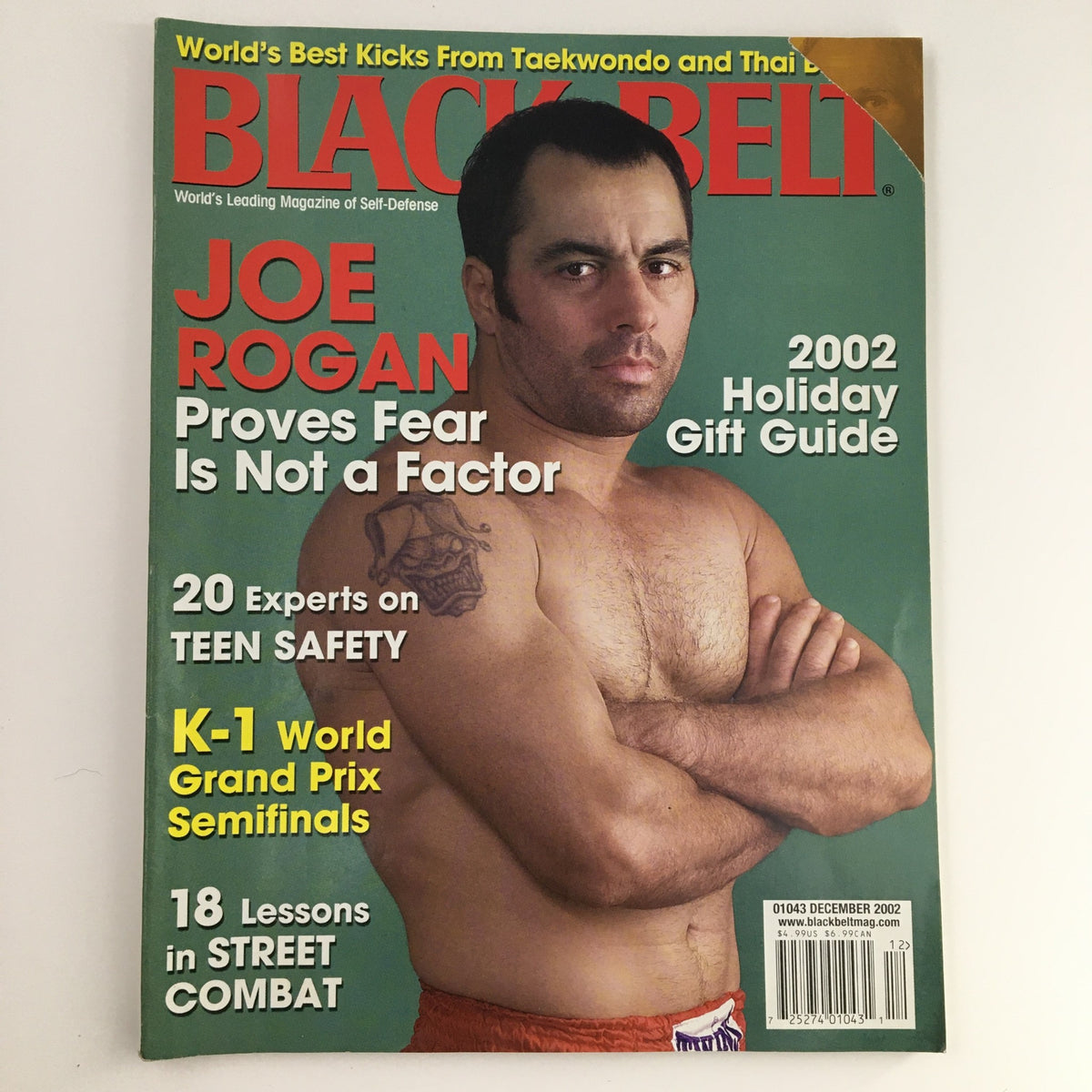 Cover of Black Belt Magazine December 2002 Vol 40 #12 featuring Joe Rogan, highlighting his insights on martial arts, the 2002 Holiday Gift Guide, and K-1 World Grand Prix Semifinals.