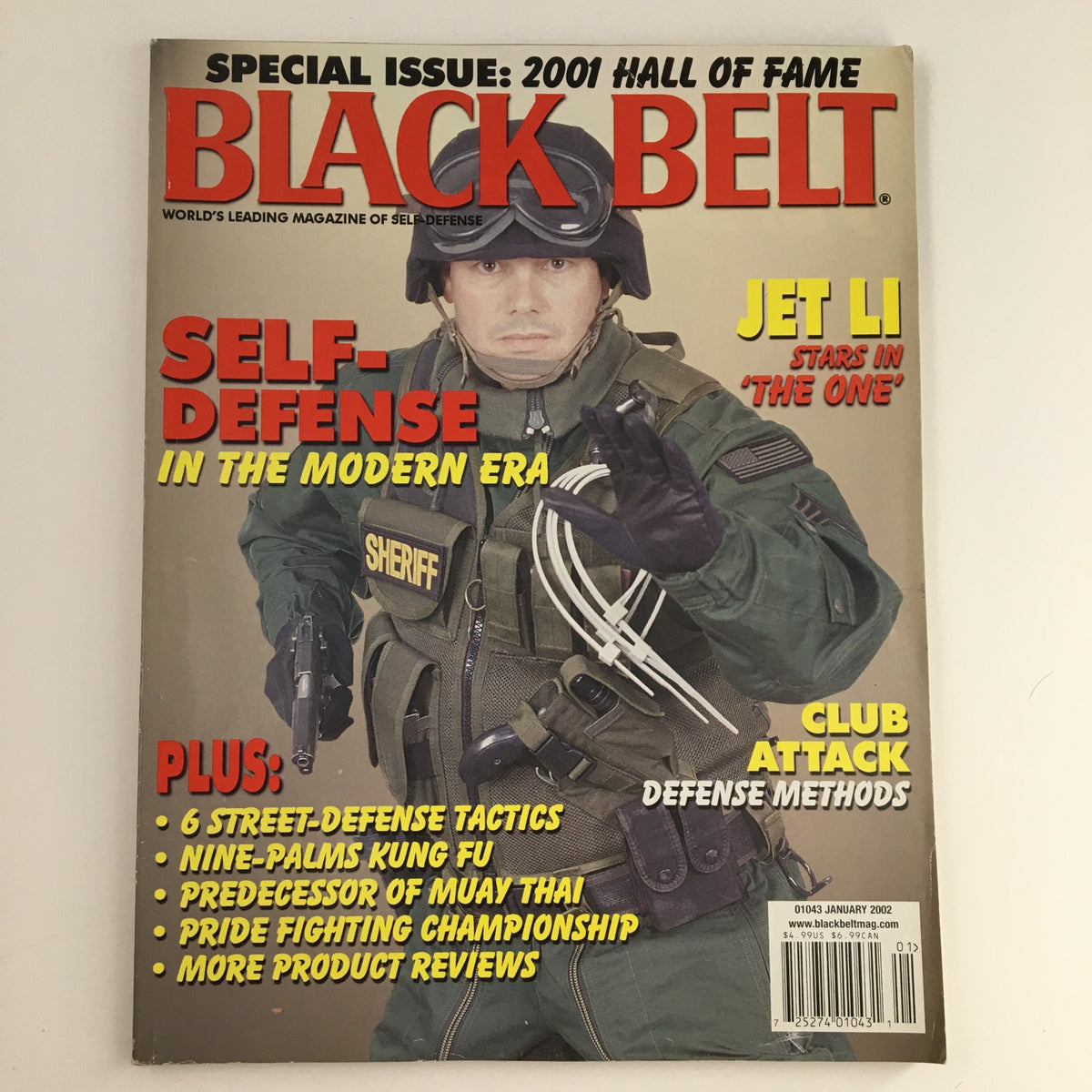 Cover of Black Belt Magazine January 2002 Vol 40 #1 featuring Jim Wagner in a tactical self-defense outfit alongside Jet Li, highlighting topics on self-defense and martial arts.