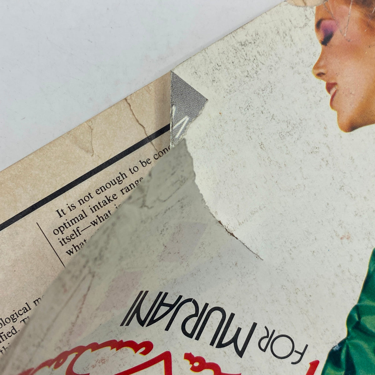 Close-up of the damaged corner of the VTG Vogue Magazine January 1980, highlighting wear and tear on the edges, indicative of its vintage condition.