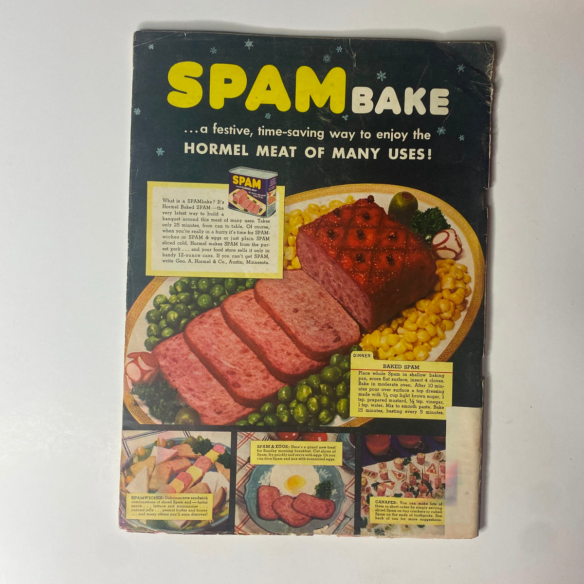 Cover of a vintage advertisement for SPAM Bake, showcasing a festive dish featuring Hormel meat. The ad presents SPAM as a versatile ingredient for various recipes.