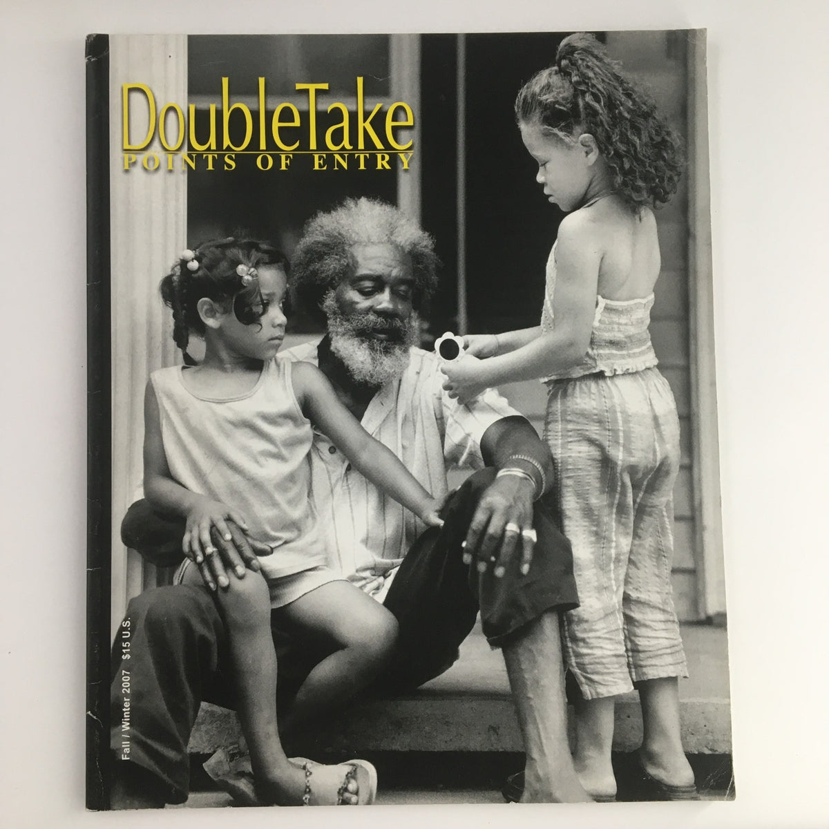Cover image of Double Take Points of Entry Fall 2007 featuring a black and white photograph of a man with two girls, highlighting the documentary work of Milton Rogovin.