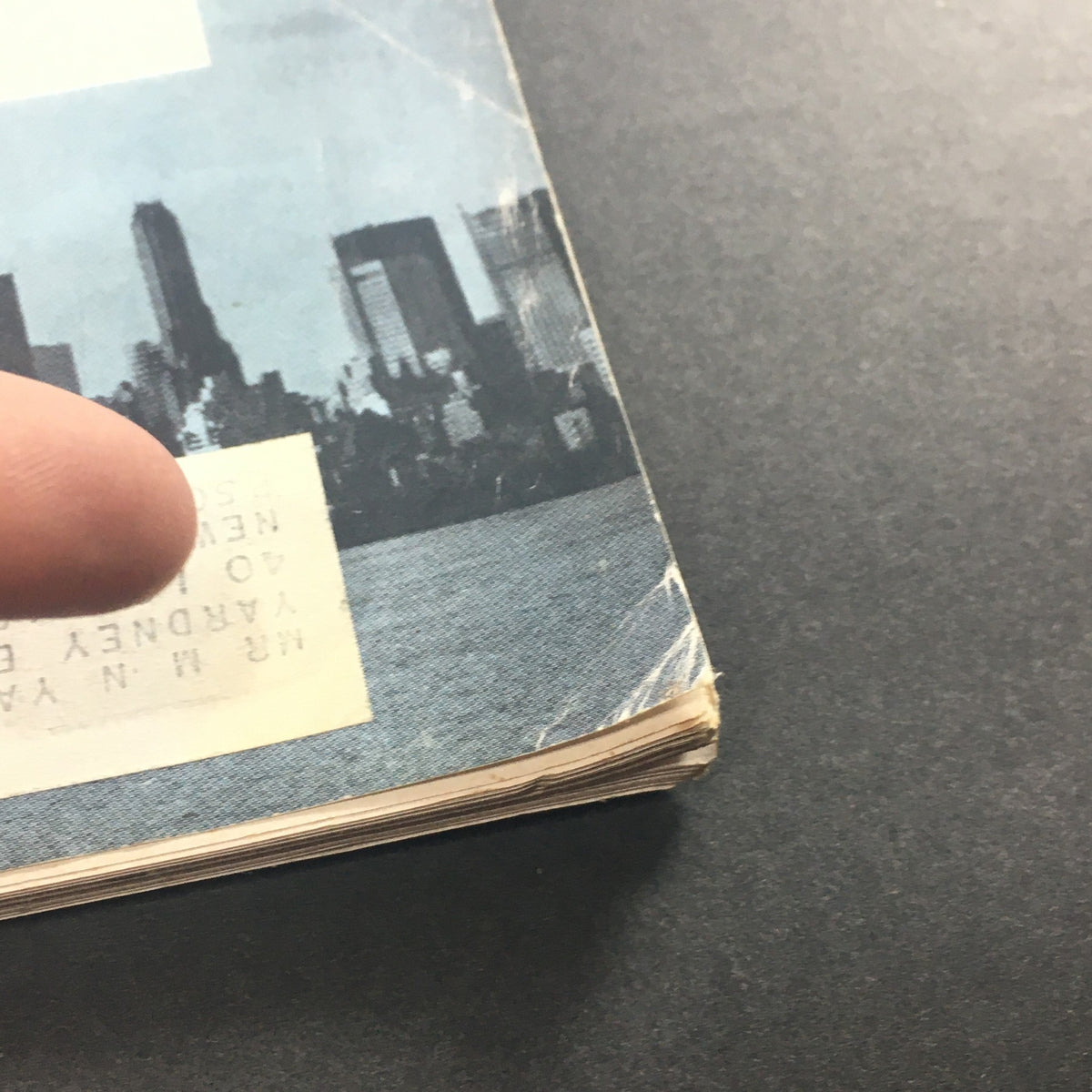 Detailed image of the bottom corner of the vintage U.S. News & World Report magazine from September 26, 1960. The photo highlights the magazine's worn edges and a label, reflecting its history and collectible nature.
