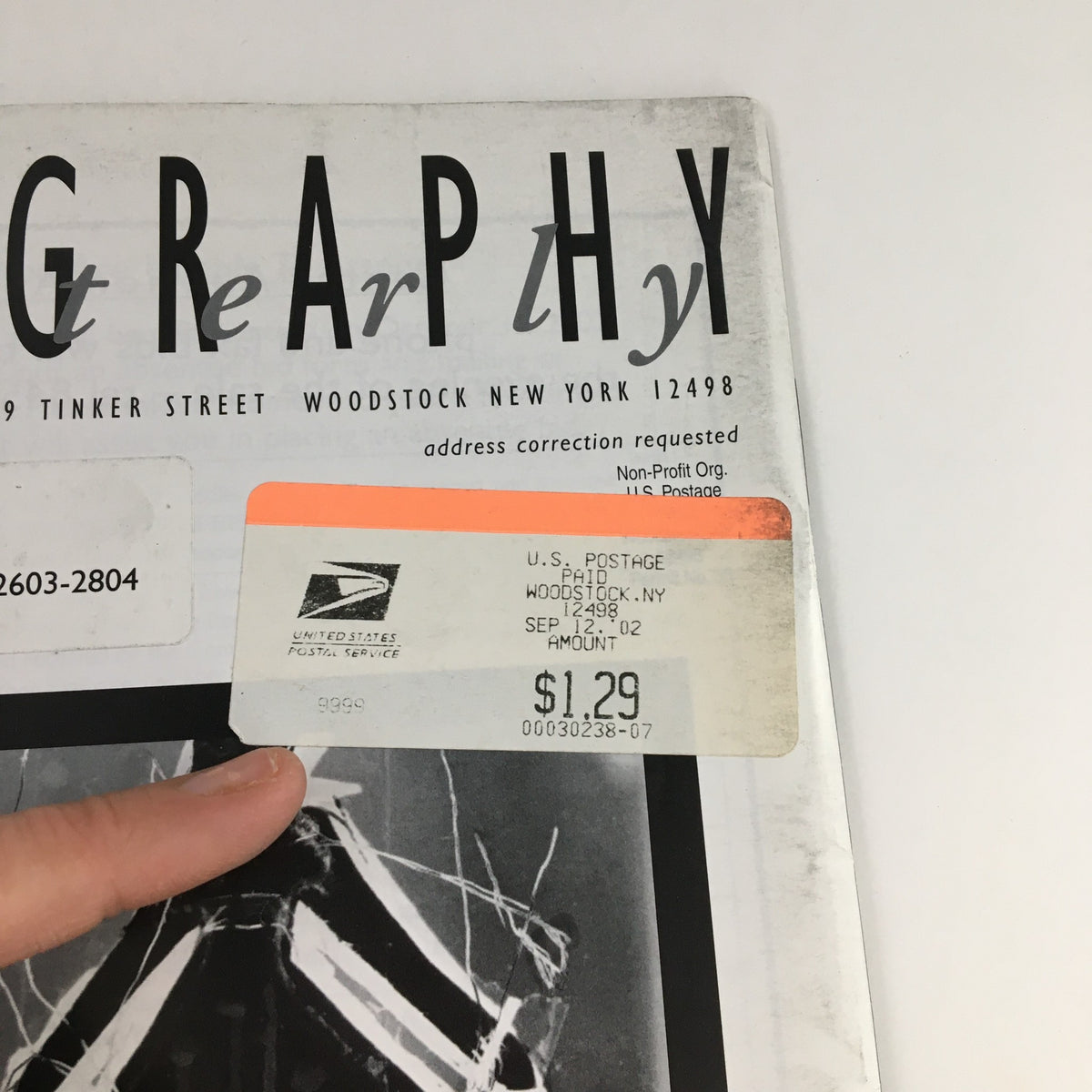 Close-up of the back cover of the Photography Quarterly Auction Catalog 2002 #84 Silver Linings by Amanda Means, highlighting a postal mark and price tag.
