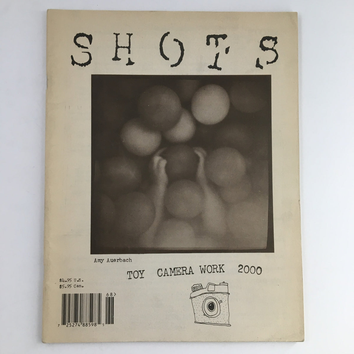 Cover of Inside Shots Magazine 2000 #68 featuring Amy Auerbach's Toy Camera Work with a blurred background and playful patterns.
