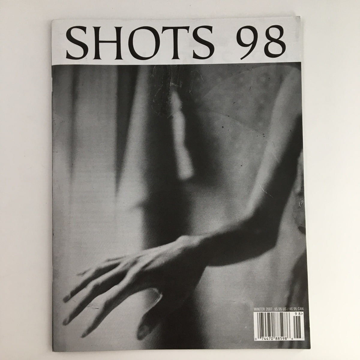 Cover of Inside Shots Magazine Winter 2007 featuring a dramatic black and white photograph of a hand. This issue showcases the 2007 Portfolio by Tamara Lischka, focusing on photography and cultural insights from the era.