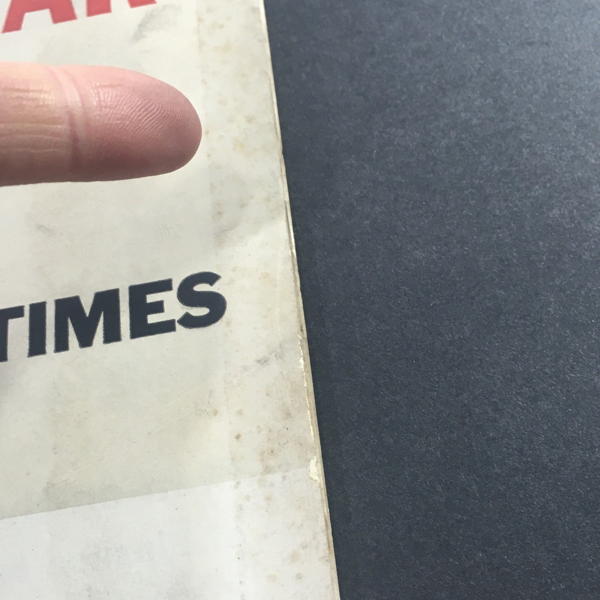 Detailed view of the worn spine of the vintage U.S. News & World Report magazine from August 29, 1960 titled 'Neither War Nor Peace', highlighting the age-related imperfections.