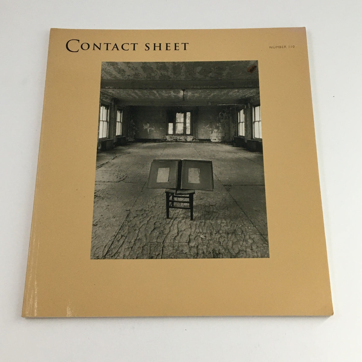 Cover of Contact Sheet Number 110 January 2001 featuring a minimalist design with a chair in an empty room, part of the Margaret Stratton Light Work Portfolio.