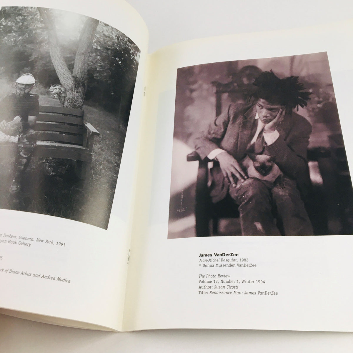 Inside page of Re-Viewing Photography March 2002 displaying a photograph titled 'James VonDerZee', highlighting notable works showcased in the Rosenwald-Wolf Gallery exhibition.