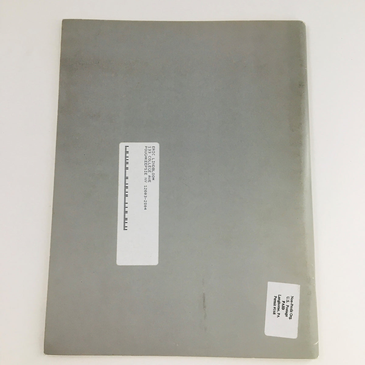 Back cover of 'Re-Viewing Photography' March 2002 magazine, showcasing address label and typical wear, indicative of its vintage status.