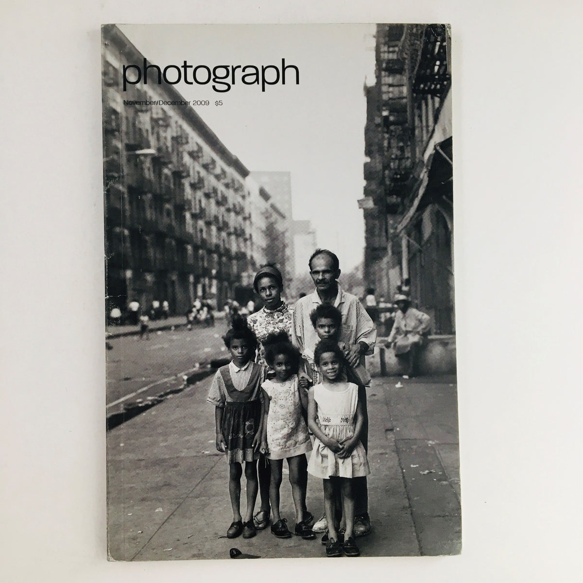 Cover of Photograph Magazine November 2009 featuring the title and a vintage street photograph of six people, highlighting Carleton Watkins Discoveries.