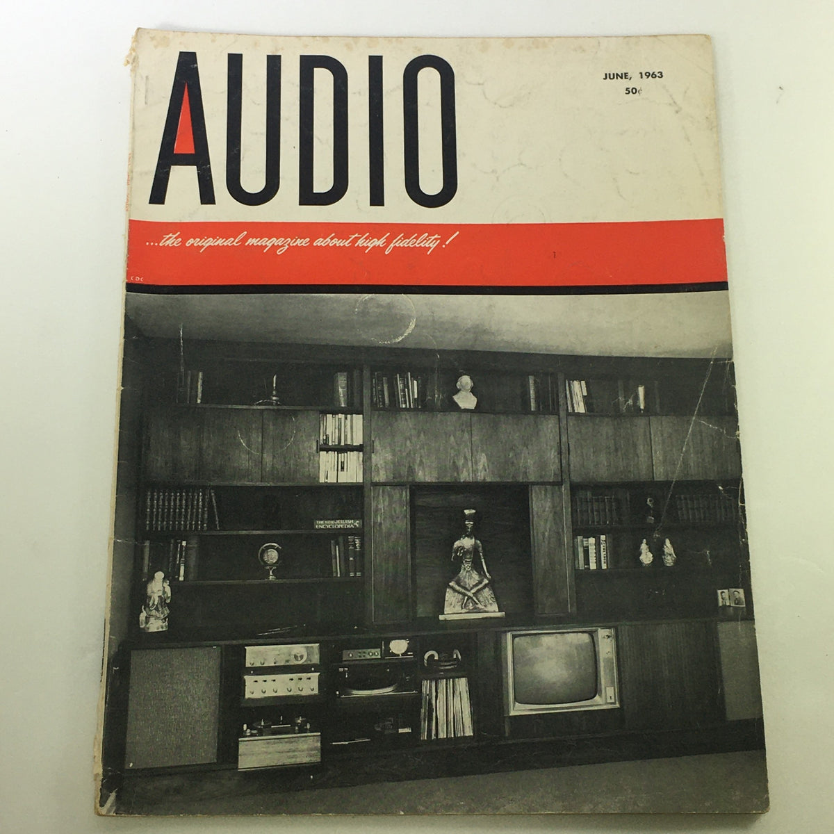 Vintage Audio and Music Magazine June 1963 cover featuring a mid-century modern interior with a stereo system, showcasing the essence of audio technology from the 1960s.