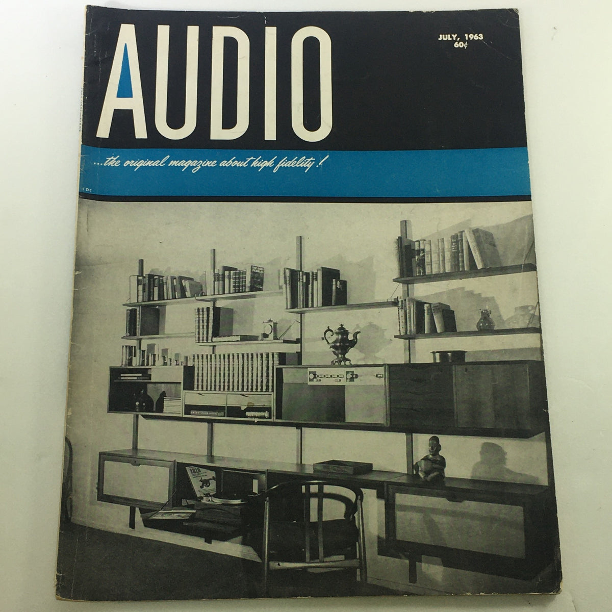 VTG Audio and Music Magazine July 1963 Cover featuring modern design elements and bookshelf layout, showcasing audio equipment and a vintage aesthetic.