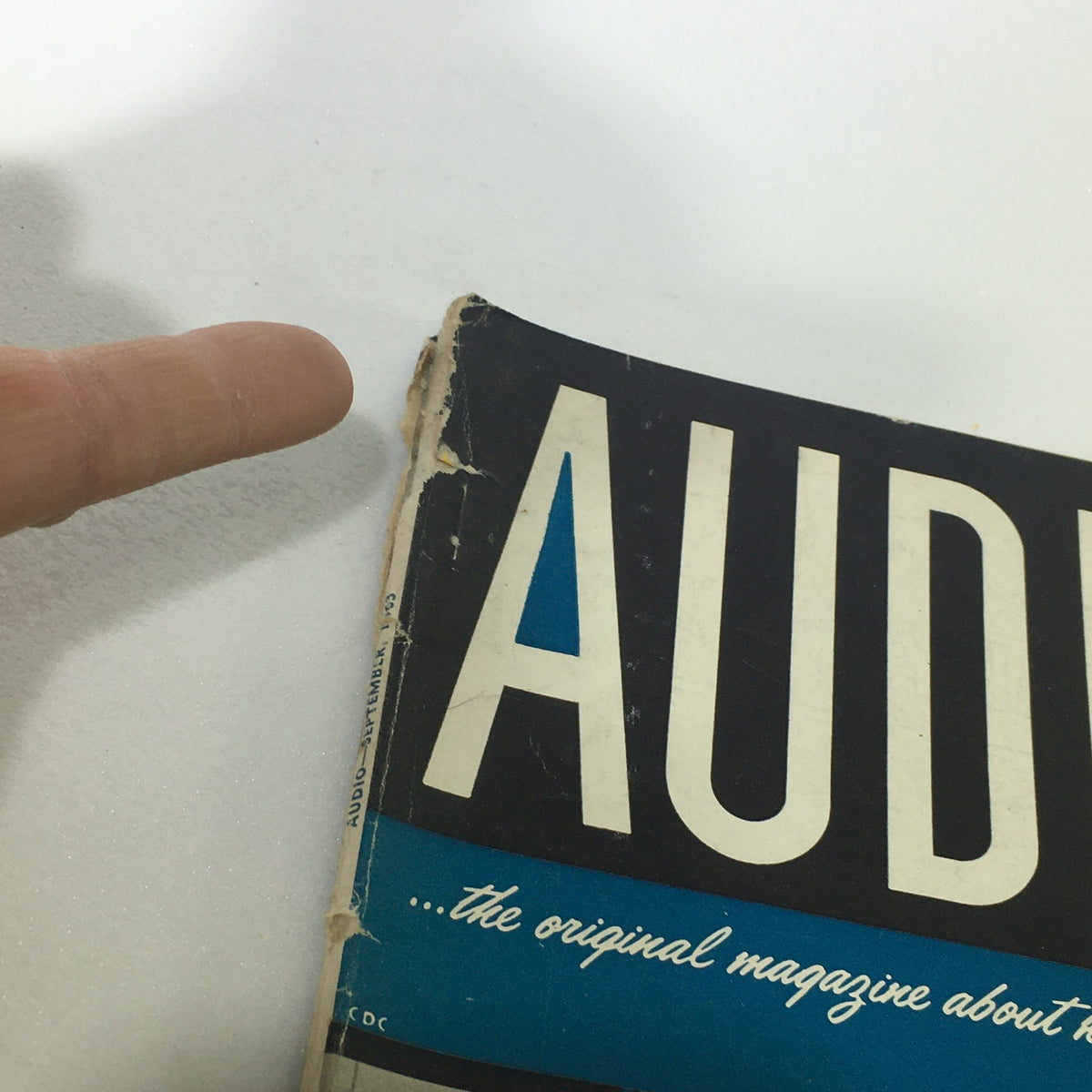 Detail close-up of the Vintage Audio and Music Magazine September 1963 showing wear on the spine and cover.