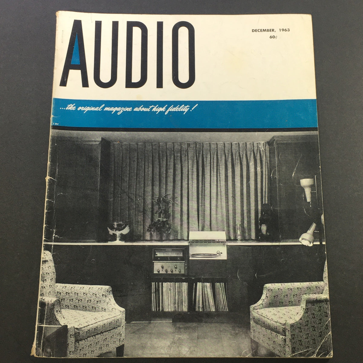 Cover of VTG Audio and Music Magazine December 1963 showcasing the title 'AUDIO' with a vintage living room setting featuring speakers and records.