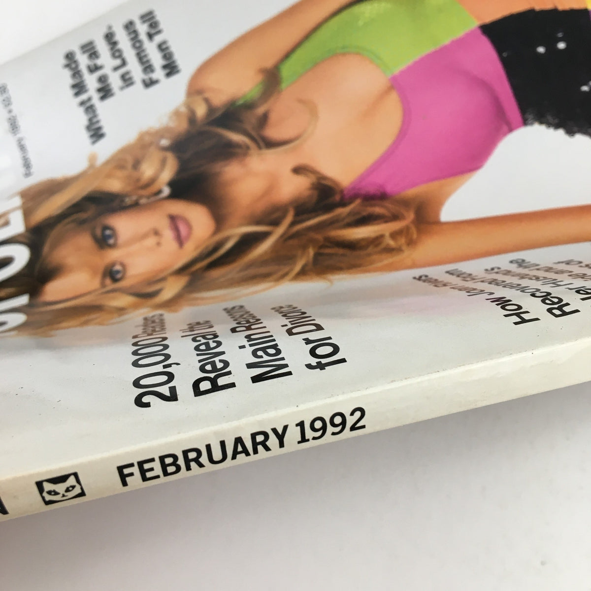 Cover of Cosmopolitan Magazine February 1992 featuring vibrant colors and a model in a pink and green outfit, highlighting articles and themes from early '90s culture.