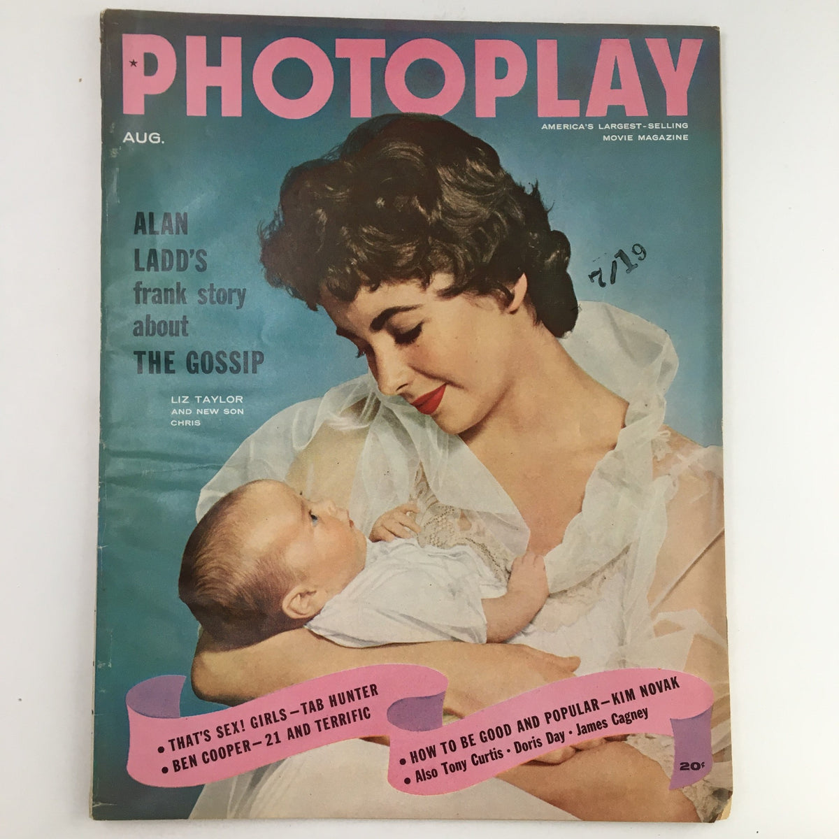 Photoplay Magazine August 1955 cover featuring Elizabeth Taylor and her son Christopher, highlighting 1950s Hollywood glamour with vibrant colors and captivating layout.