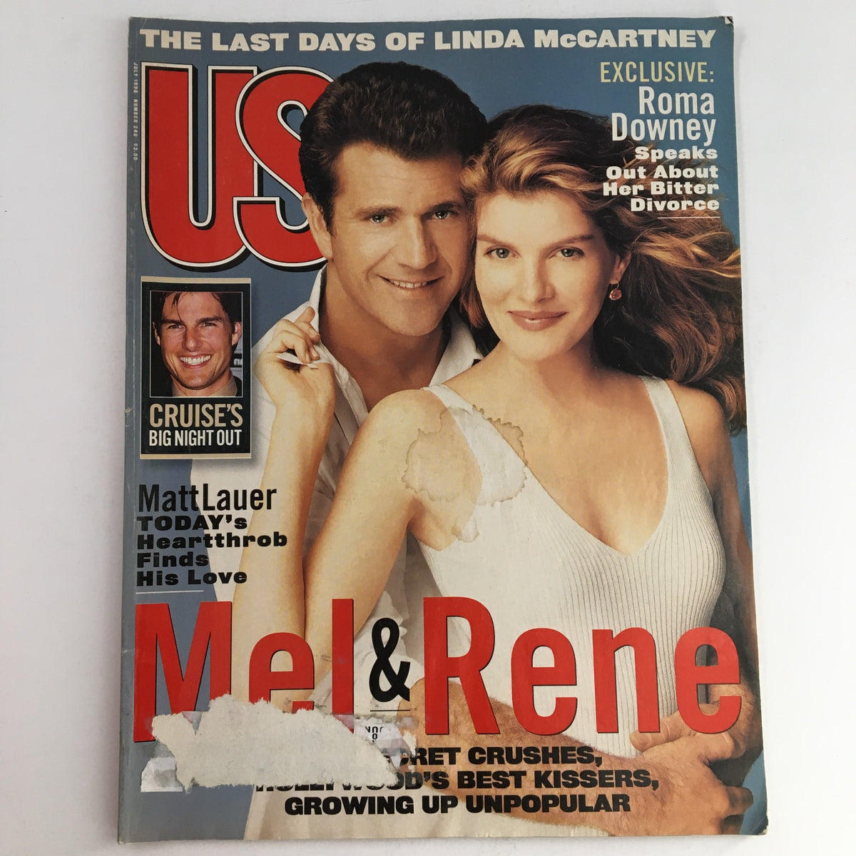 Cover of US Entertainment Magazine from July 1996 featuring Mel Gibson and Rene Russo, with a small photo of Tom Cruise. The cover highlights the latest celebrity news and pop culture moments from the 1990s.