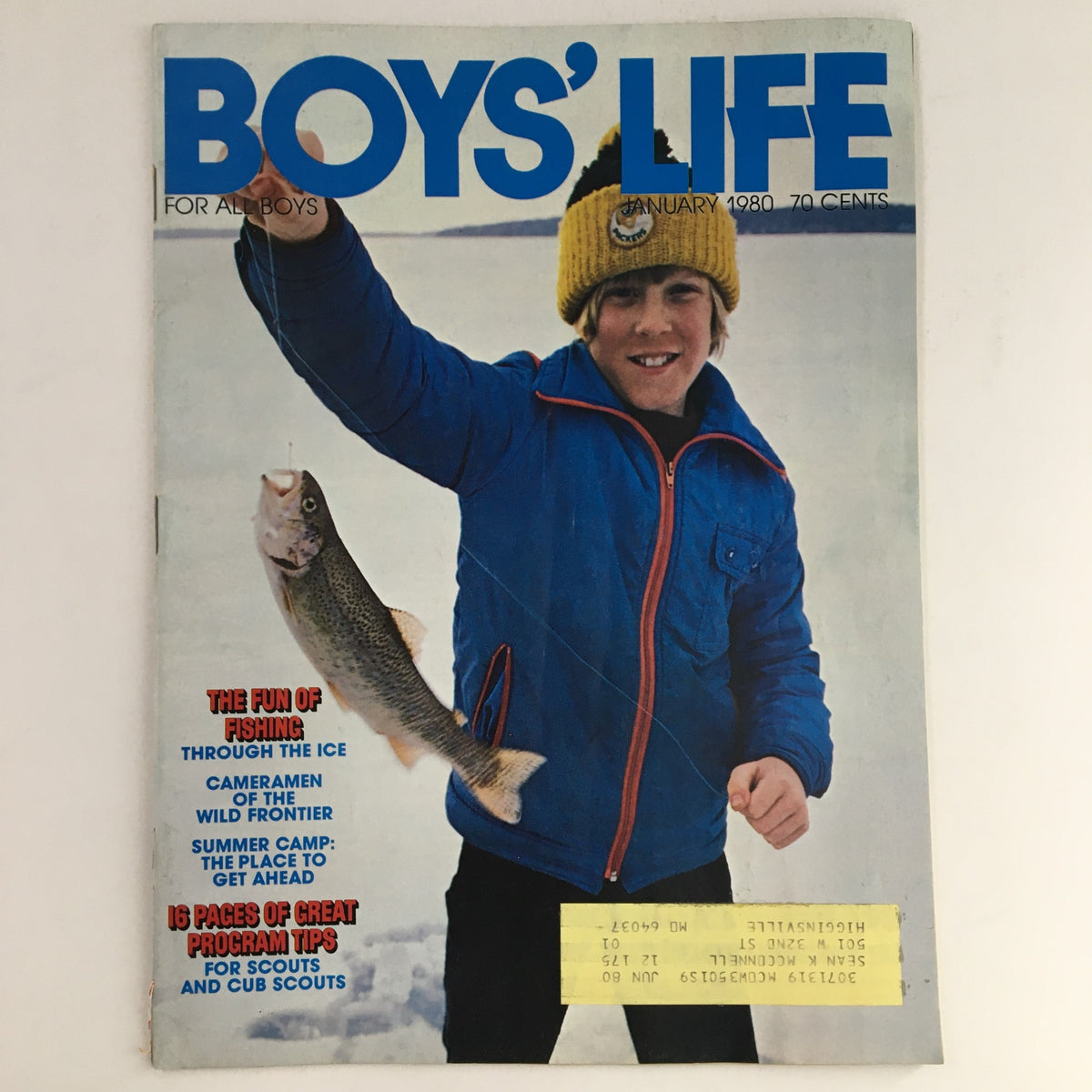 Boys' Life Magazine January 1980 cover featuring a young boy holding a fish, highlighting the article 'The Fun of Fishing Through The Ice', showcasing winter outdoor activities for boys.