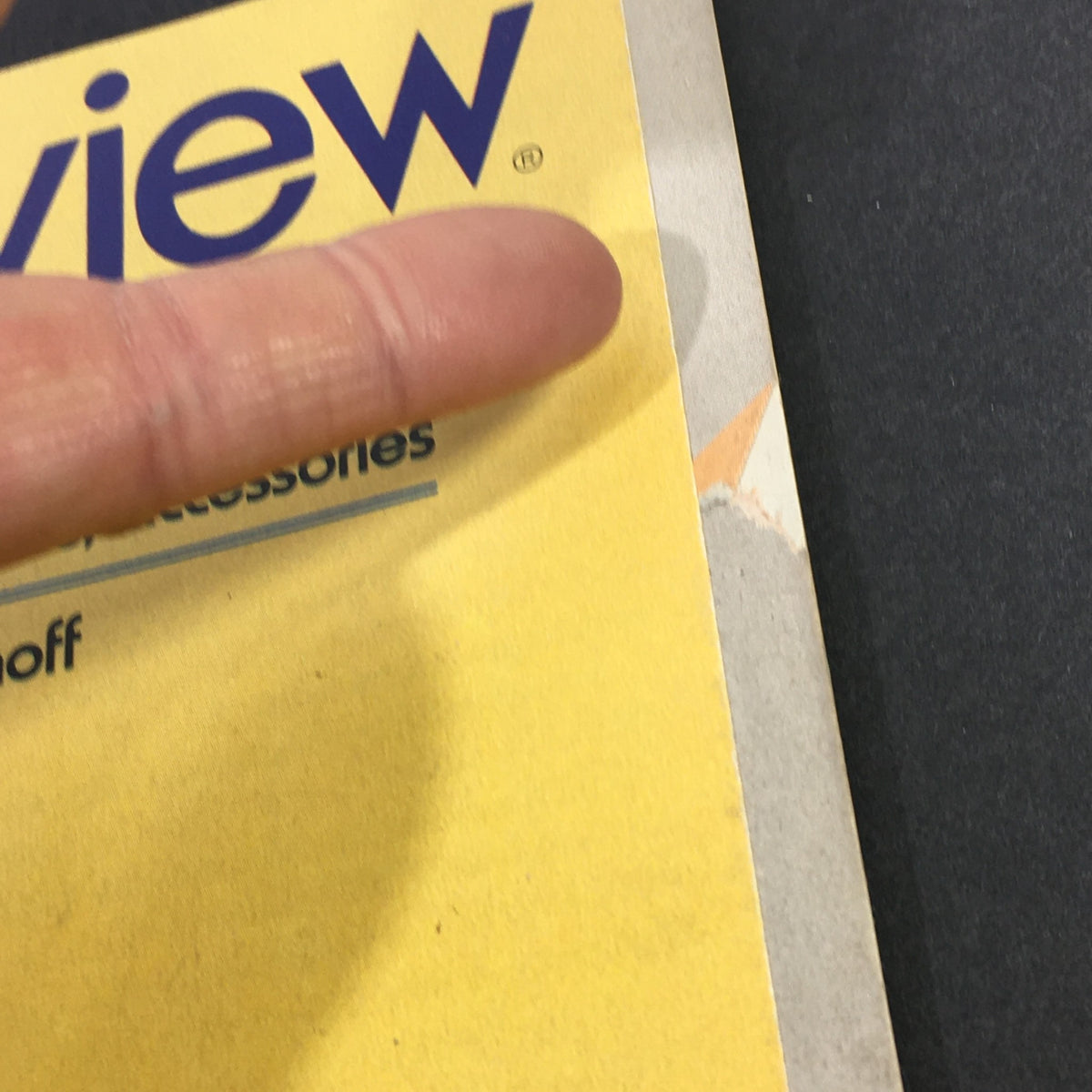 Close-up view of the cover of the June 1982 Stereo Review magazine, highlighting the title and a finger pointing at an article section on new audio products.